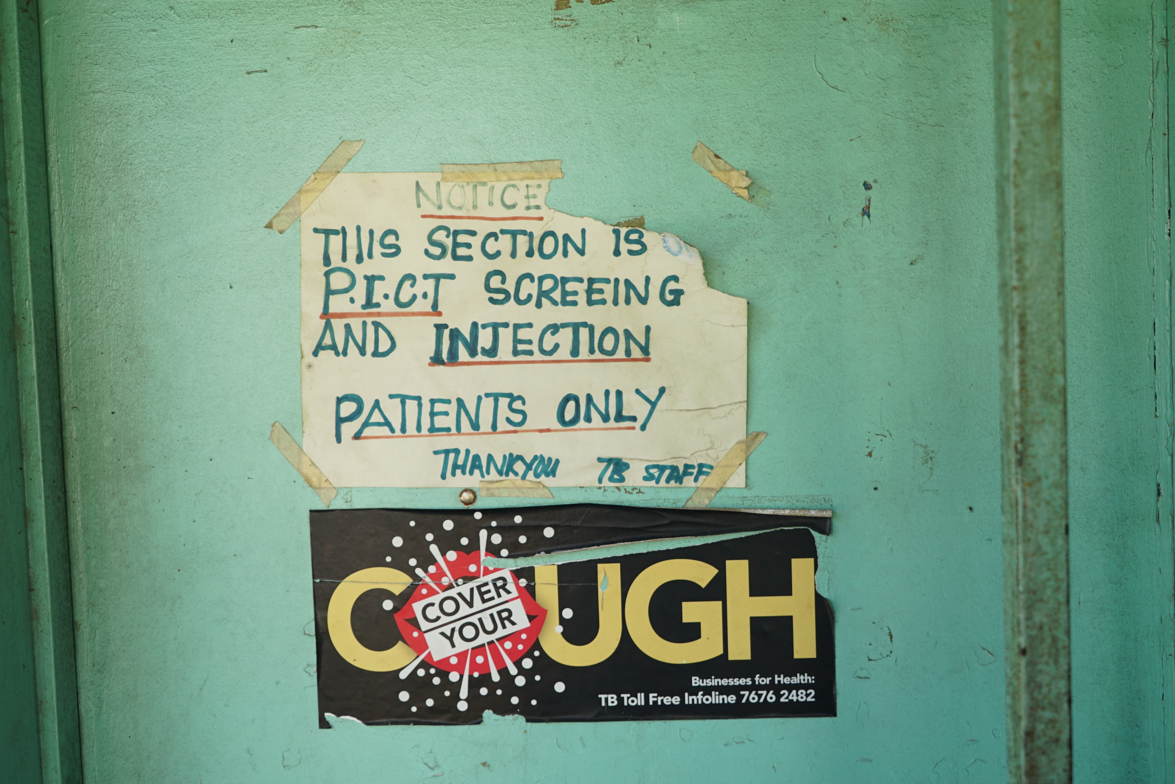 A sign teaches people to cover their mouths when they cough