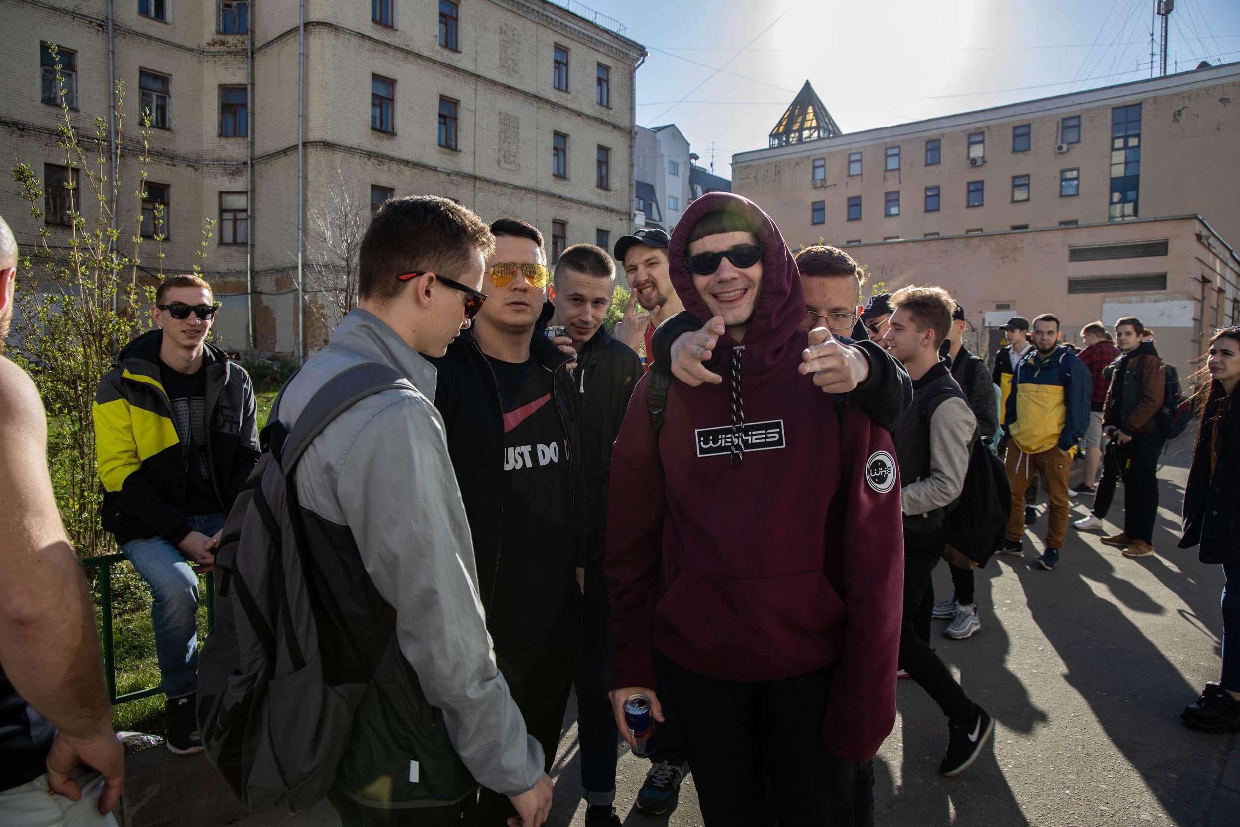 A group of young men stand outside in Russia.