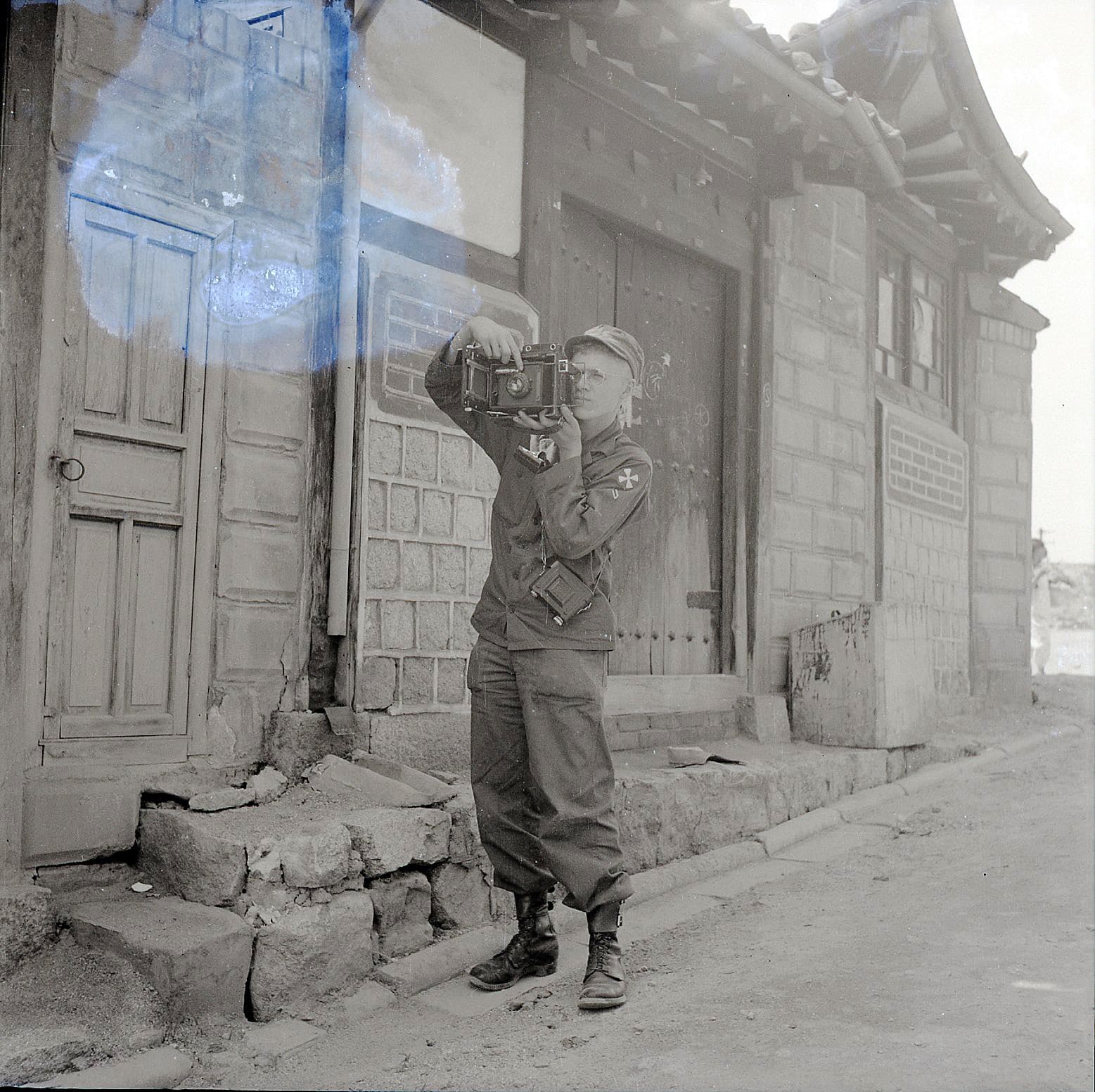 allan manuel takes a photo in korea