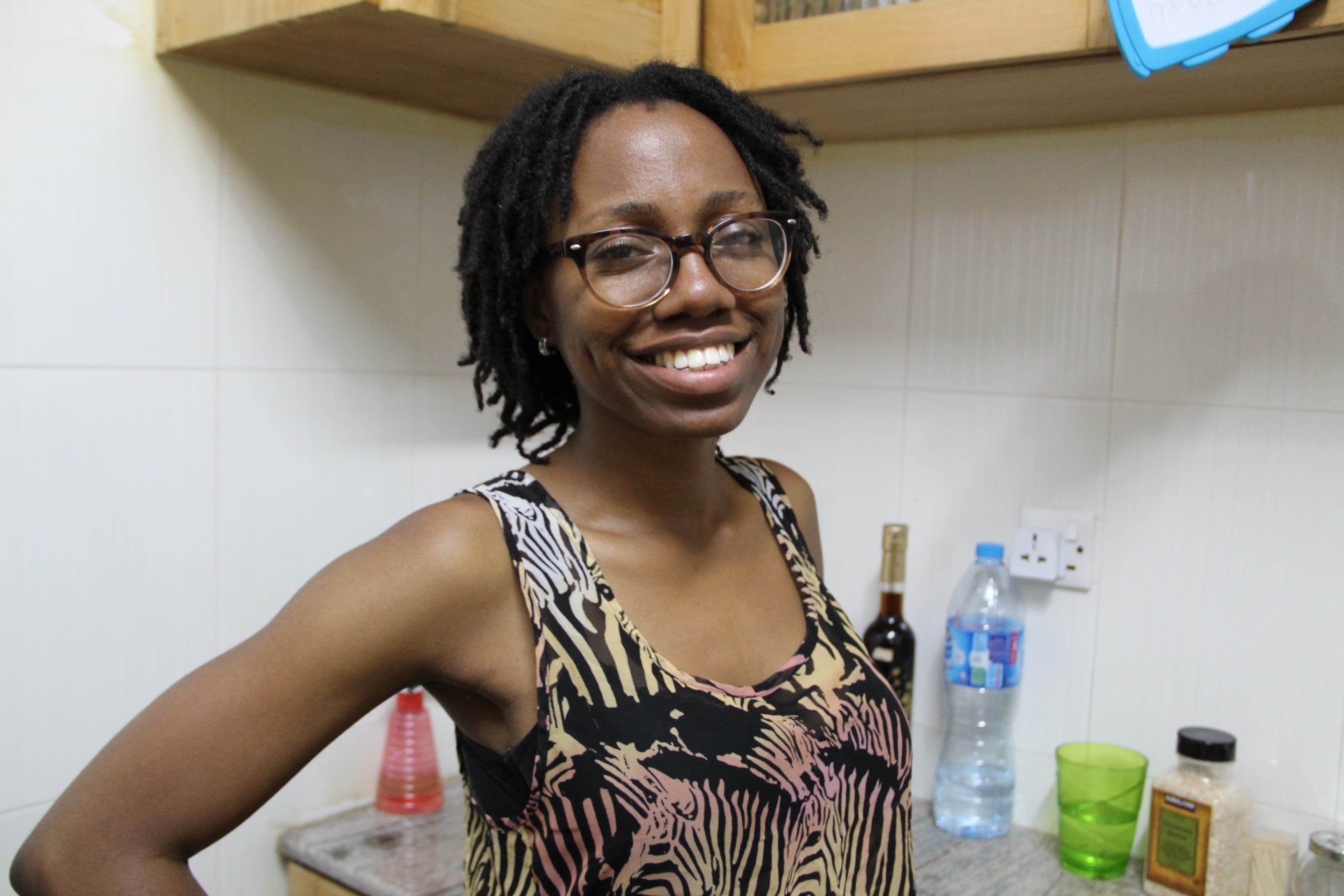 Woman with glasses smiles