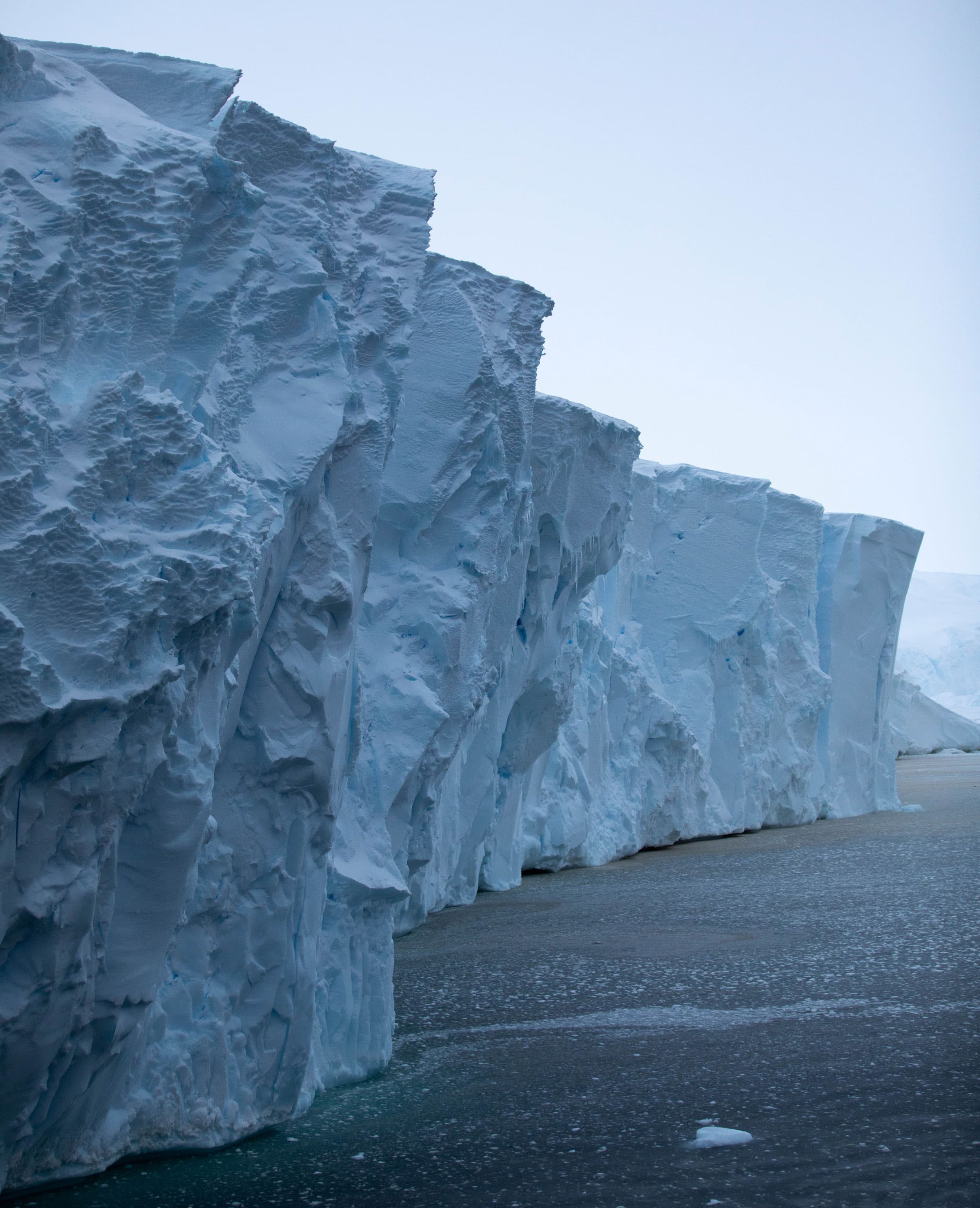 An iceberg rises out of the water