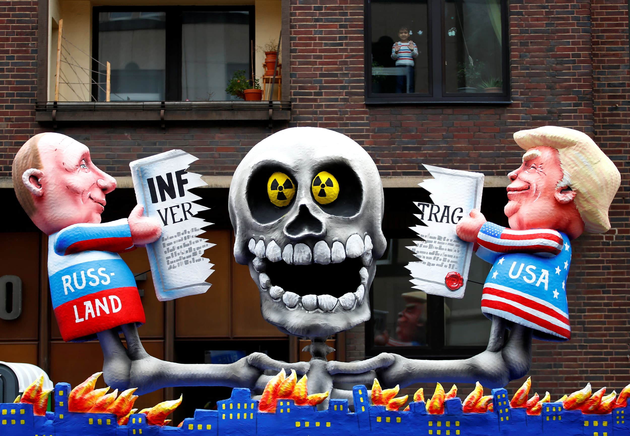 Figures depicting Russian President Vladimir Putin and US President Donald Trump breaking the INF treaty