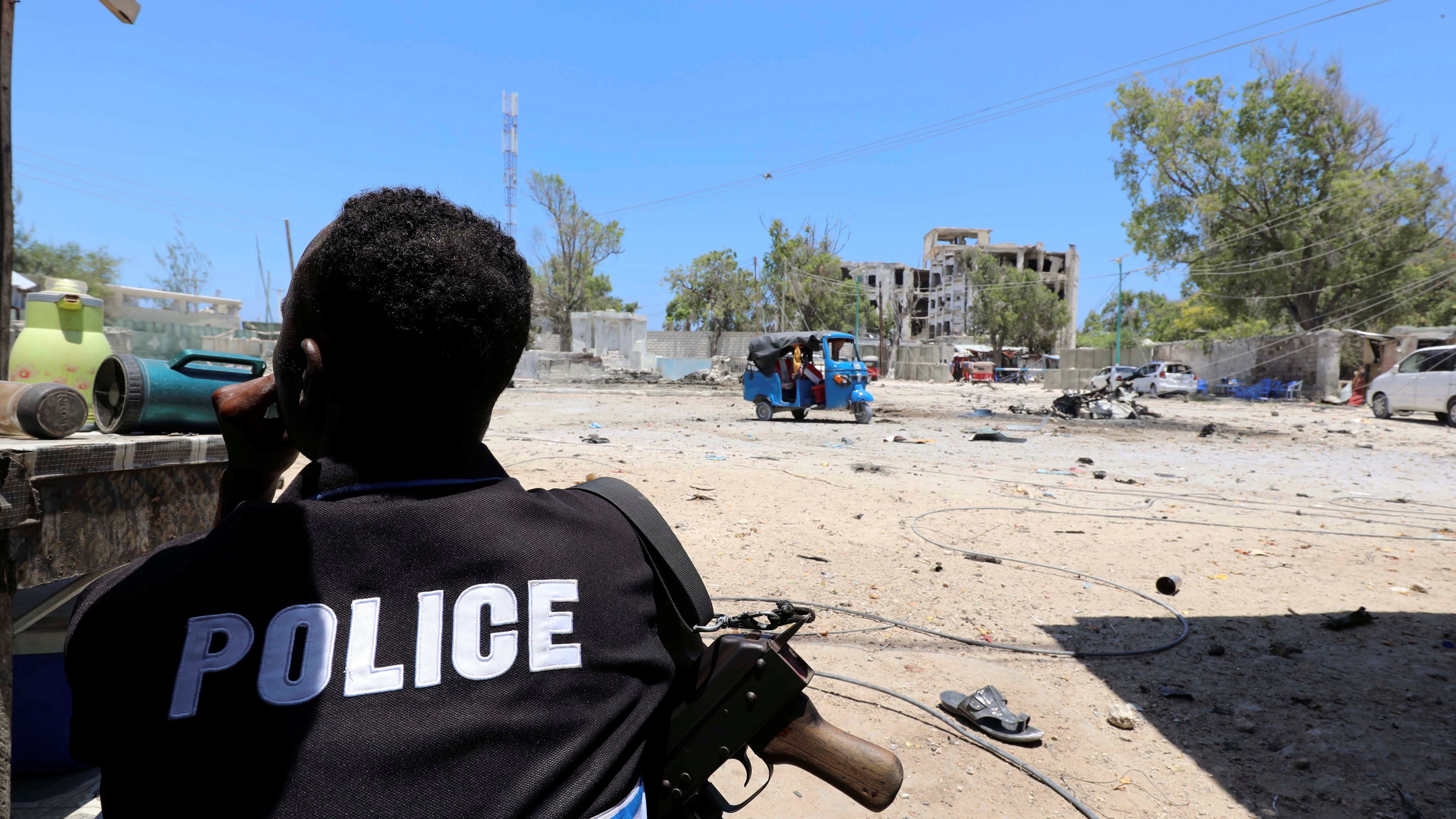 A policeman wears a black uniform