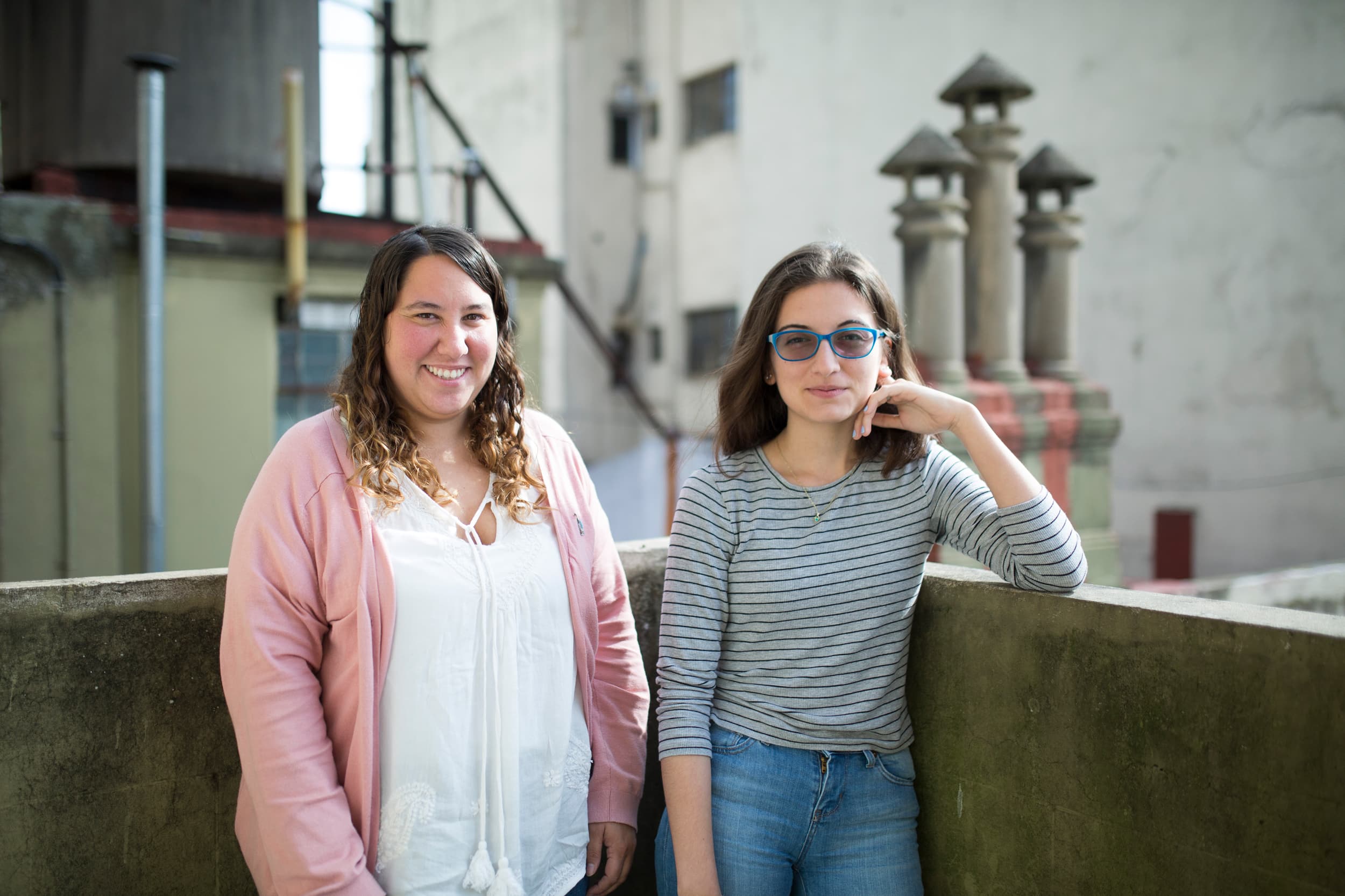 Two women standing outside.