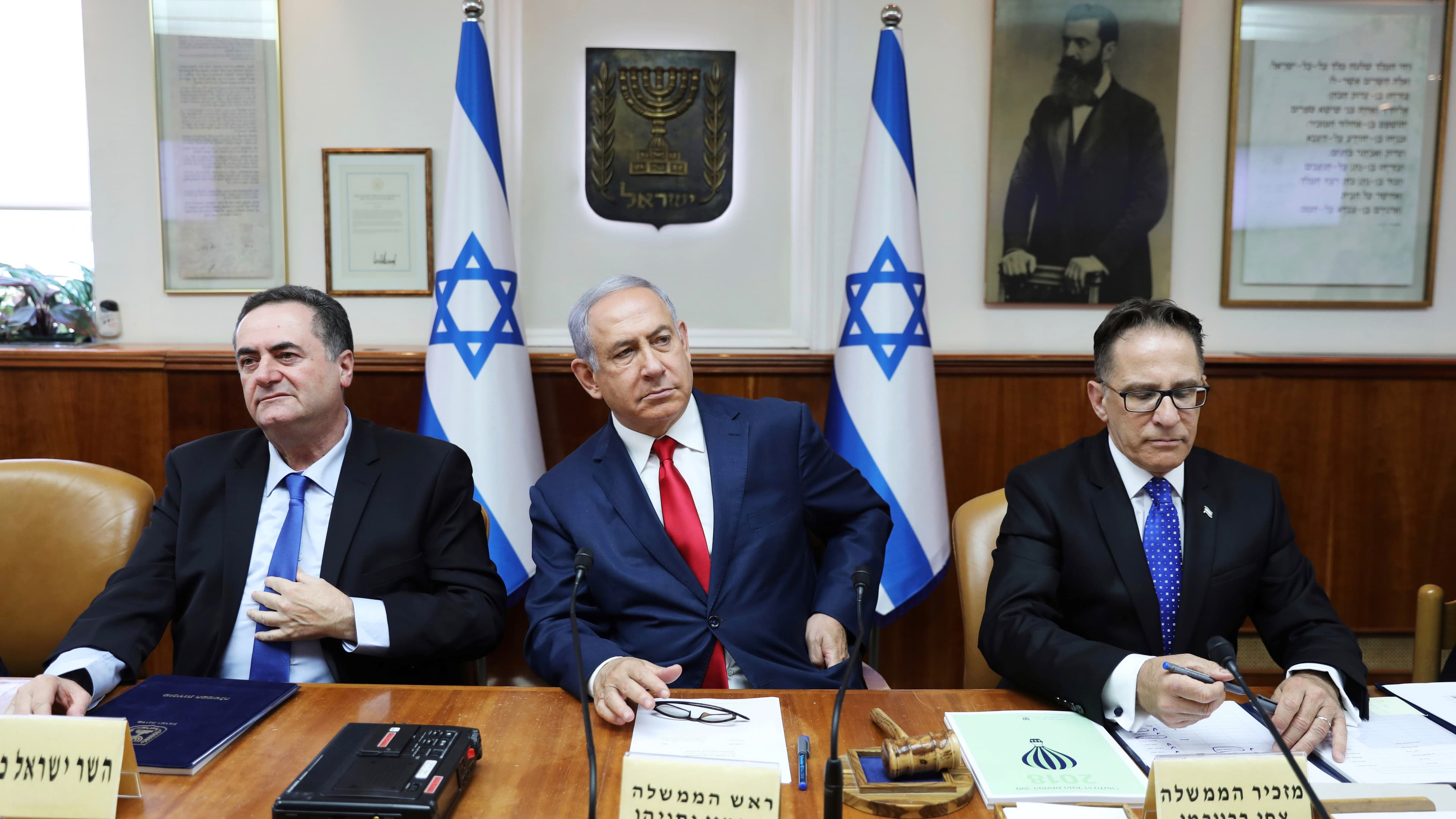 Israeli Prime Minister Benjamin Netanyahu (center), Cabinet Secretary Tzachi Braverman (right) and Minister of Foreign Affairs Israel Katz (left), attend the weekly cabinet meeting in Jerusalem on July 7, 2019.