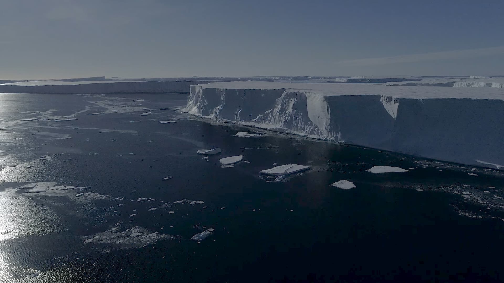 Drone footage shows large icebergs that have recently broken off the ice shelf in West Antarctica.