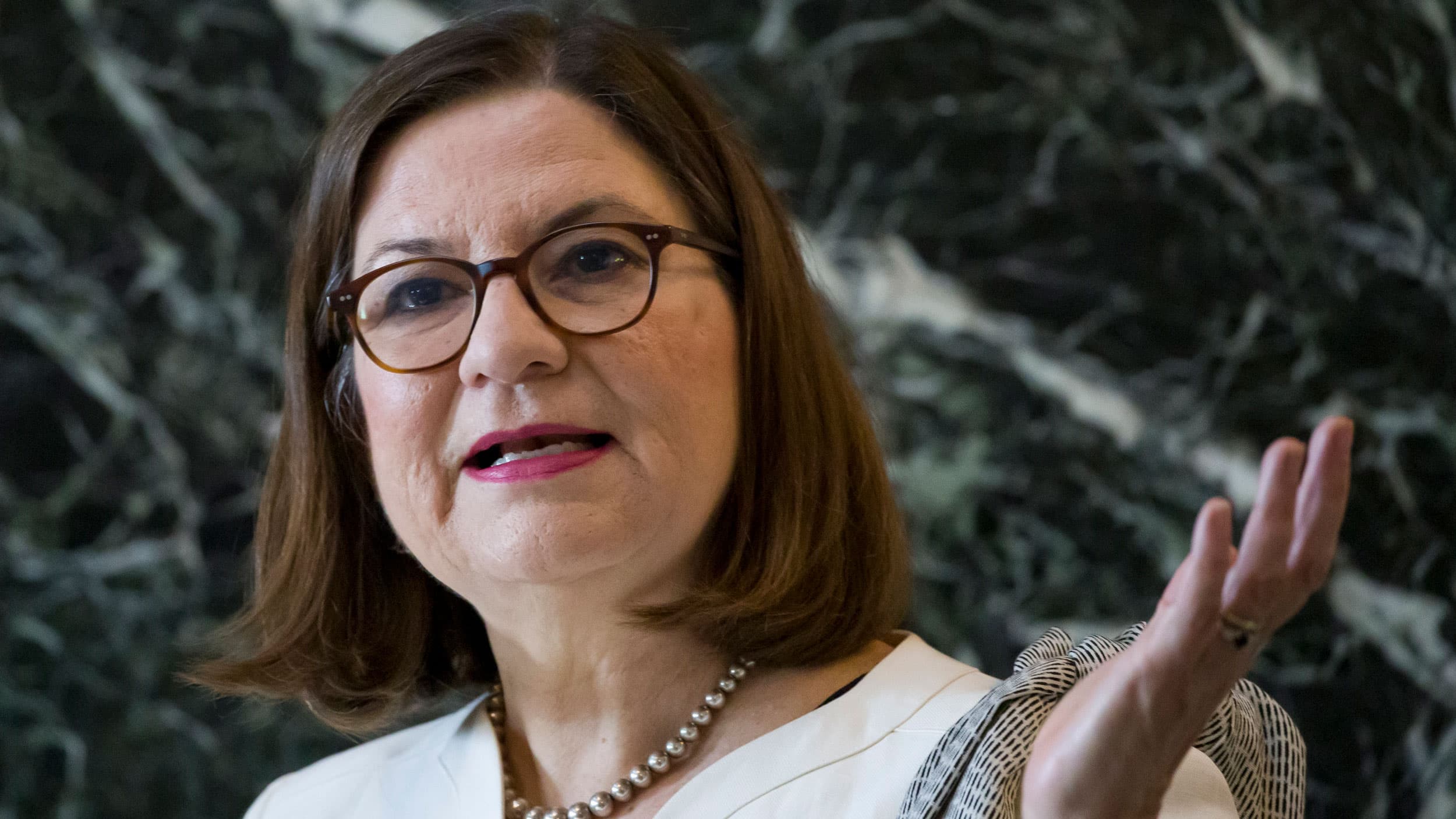 A close-up of a woman speaking