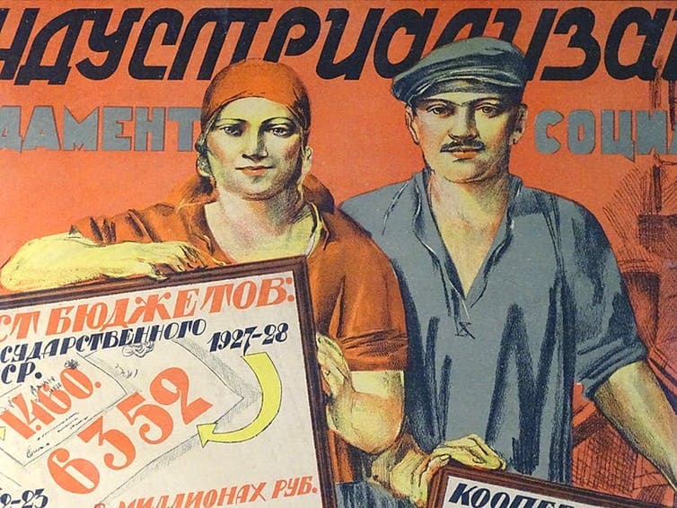 An old Soviet propaganda poster showing a man and a woman holding signs in Russian.