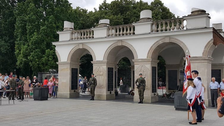 Soldiers guarding a tomb outside in Poland.