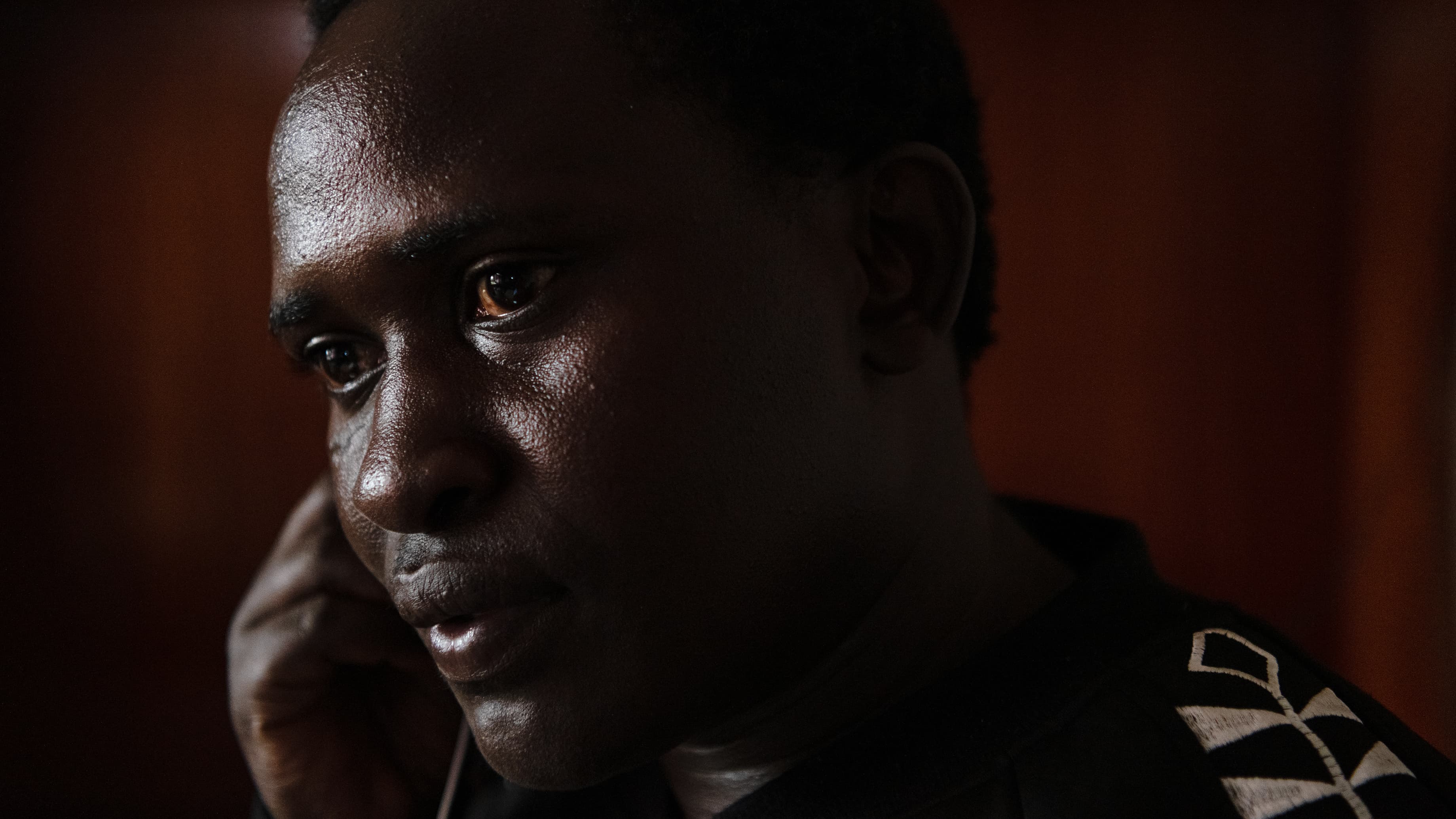 Up close image of Kenyan man wearing black sweatshirt