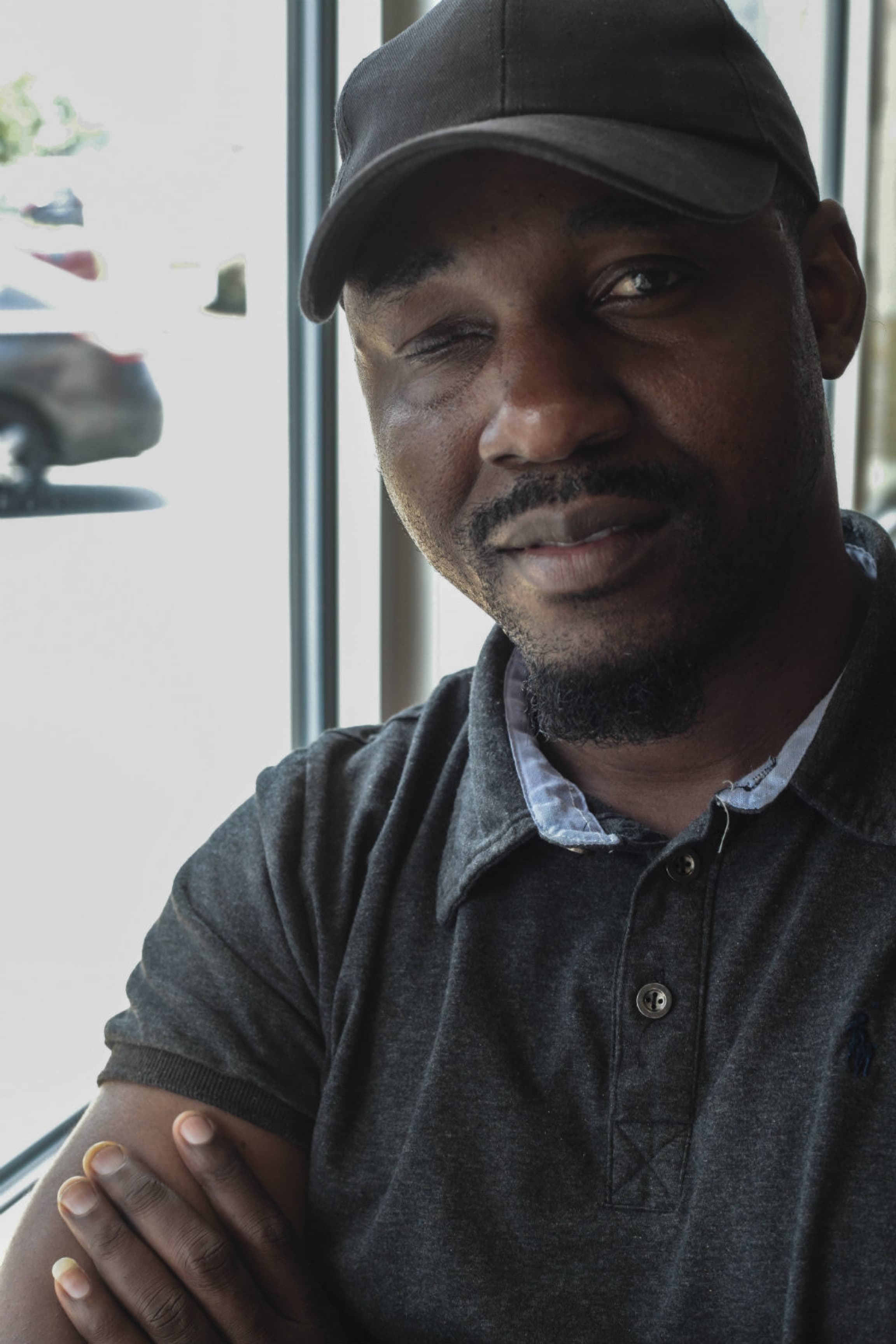 A man smiles at the camera.