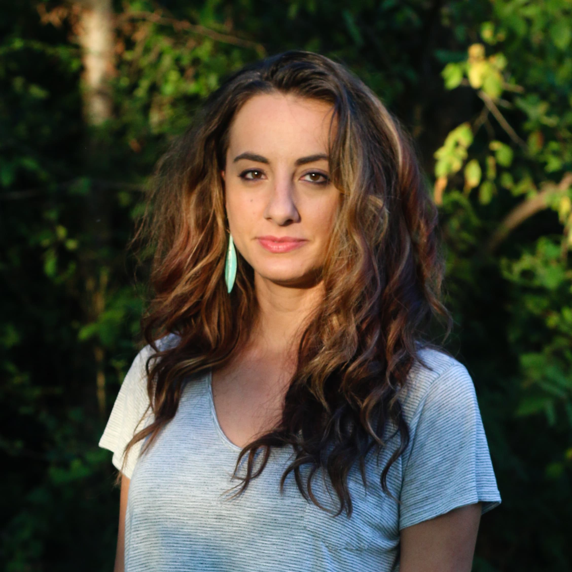 A woman standing in front of a camera