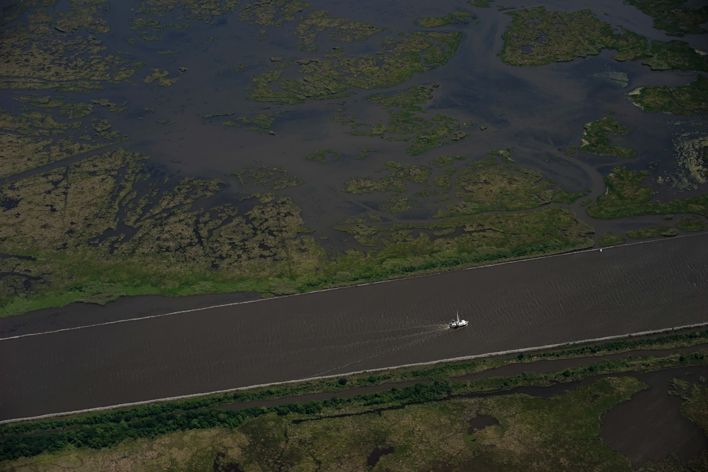 A view of the Mississippi River from an airplane above showing a straightened section of the formerly curvy river.