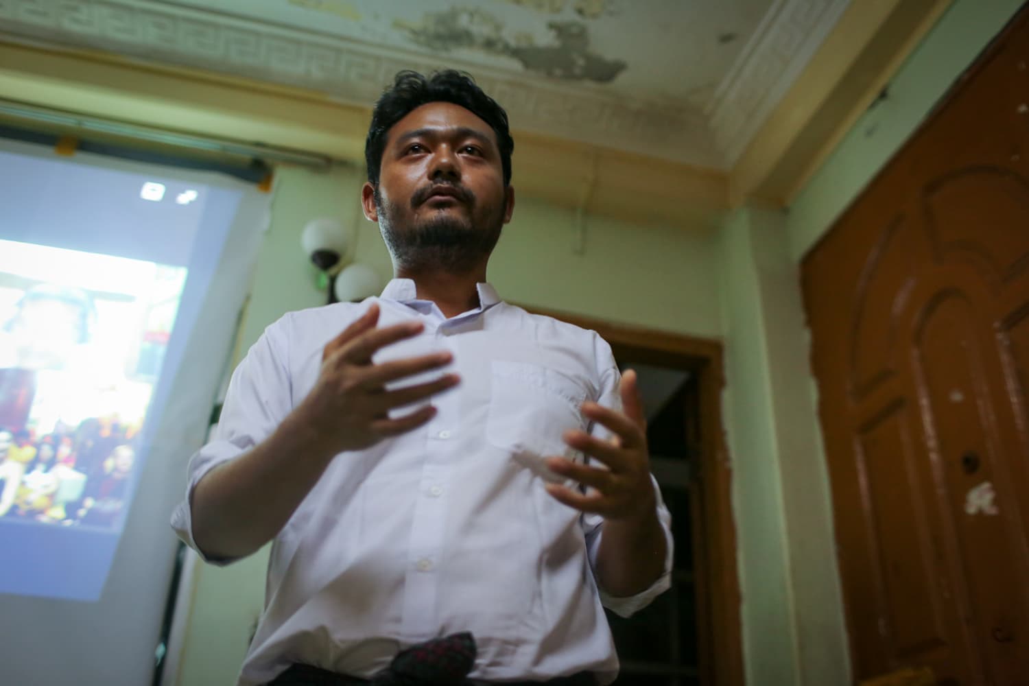 A man gestures with his hands