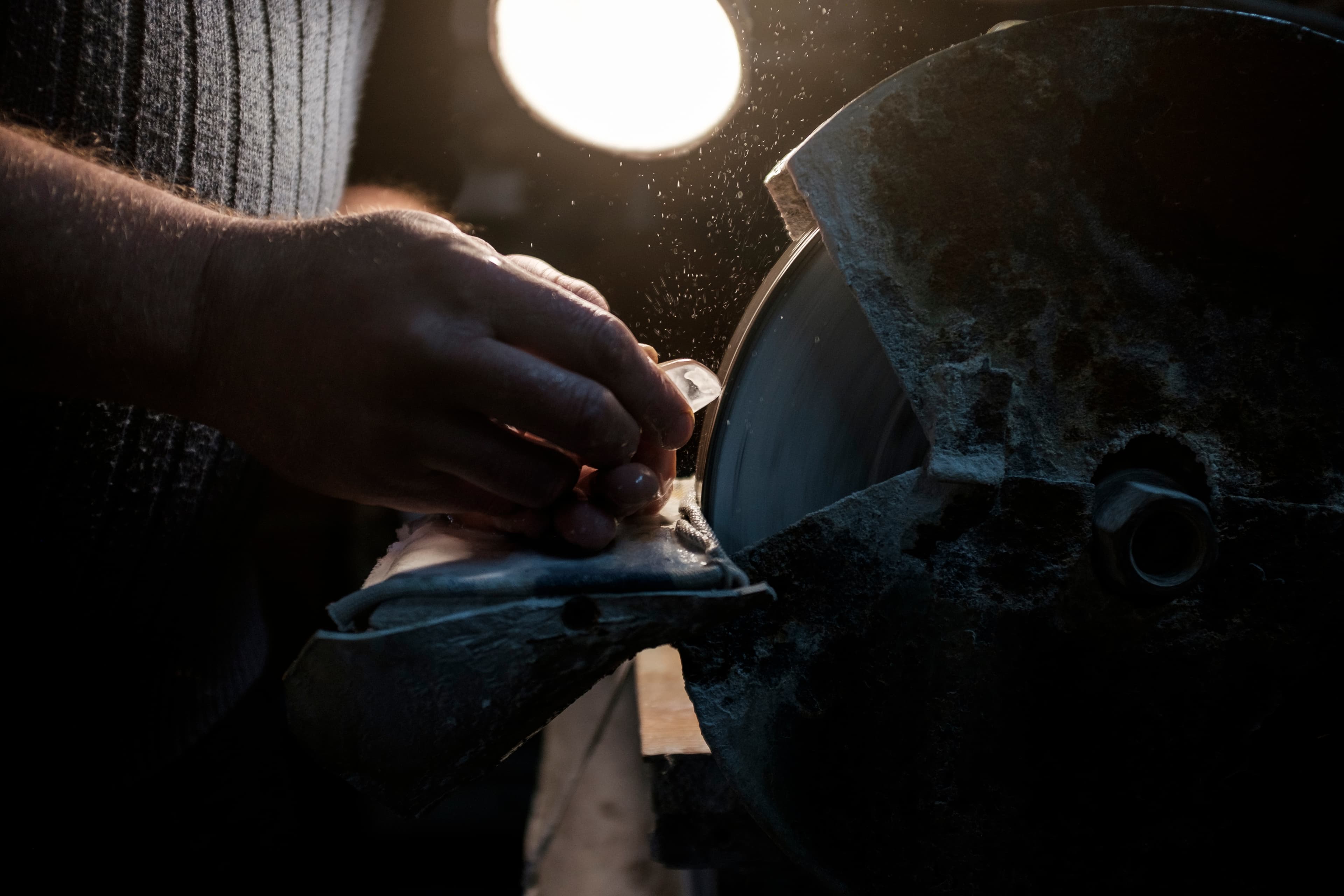 A close up of an eyeglass lens being cut