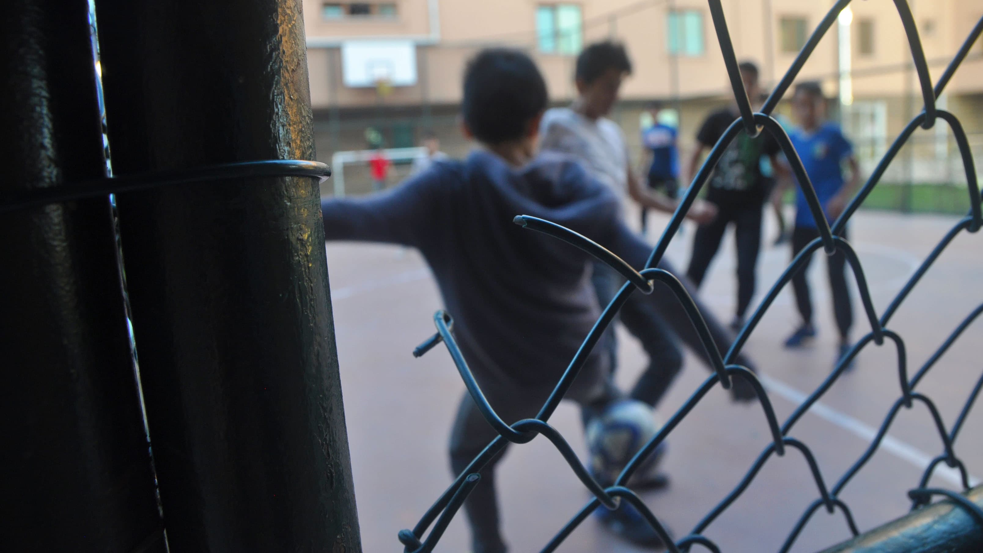 Students play a soccer game on a basketball court at a boarding school for Uighur children on the outskirts of Istanbul, Turkey.