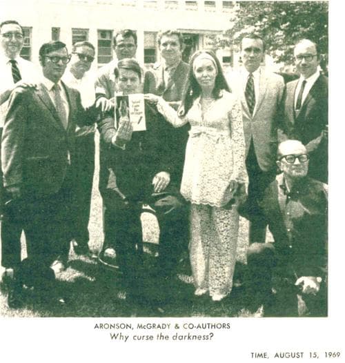 Some of the co-conspirators pose outside of the Newsday headquarters.