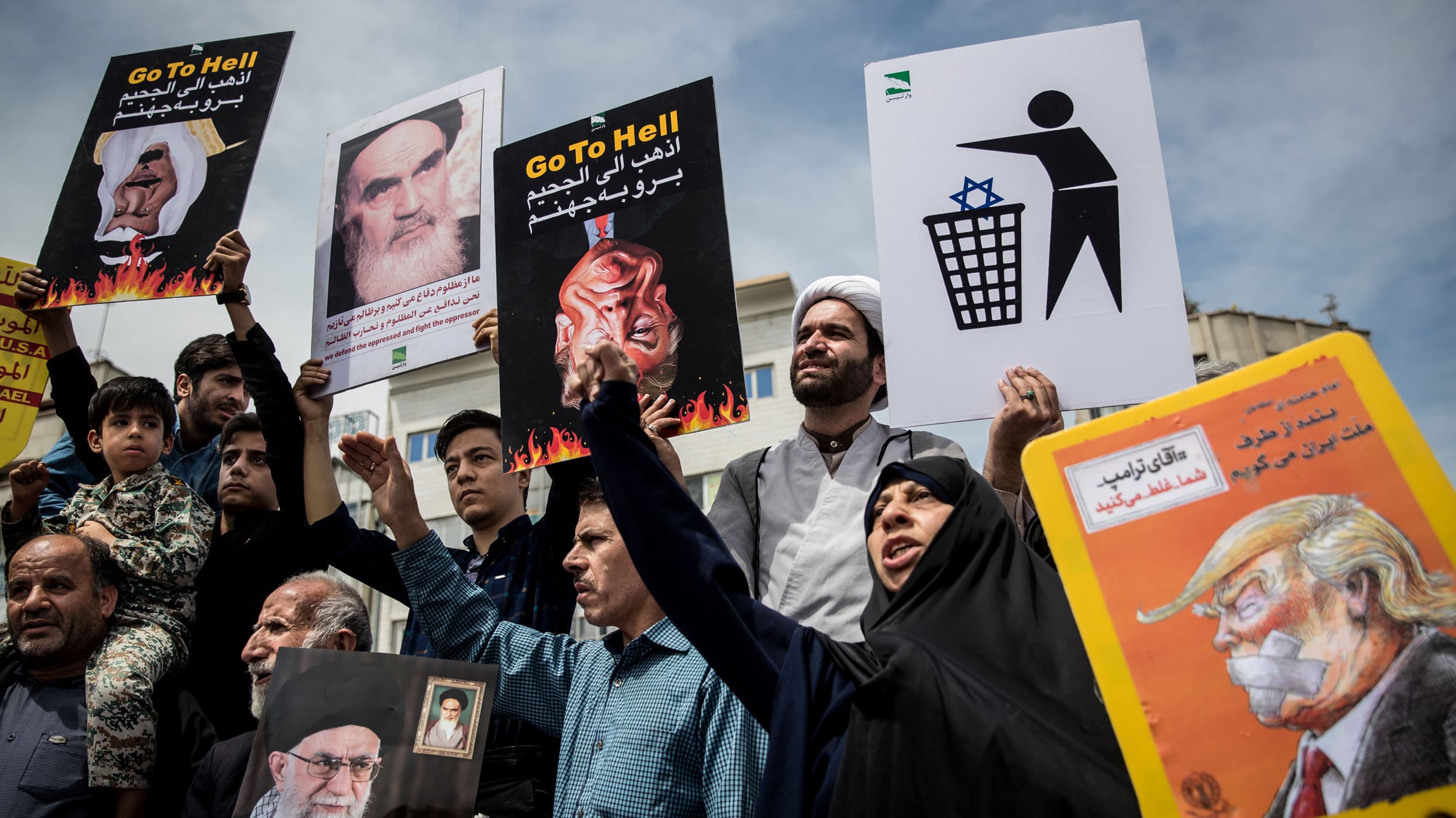 Iranians shout slogans during a protest