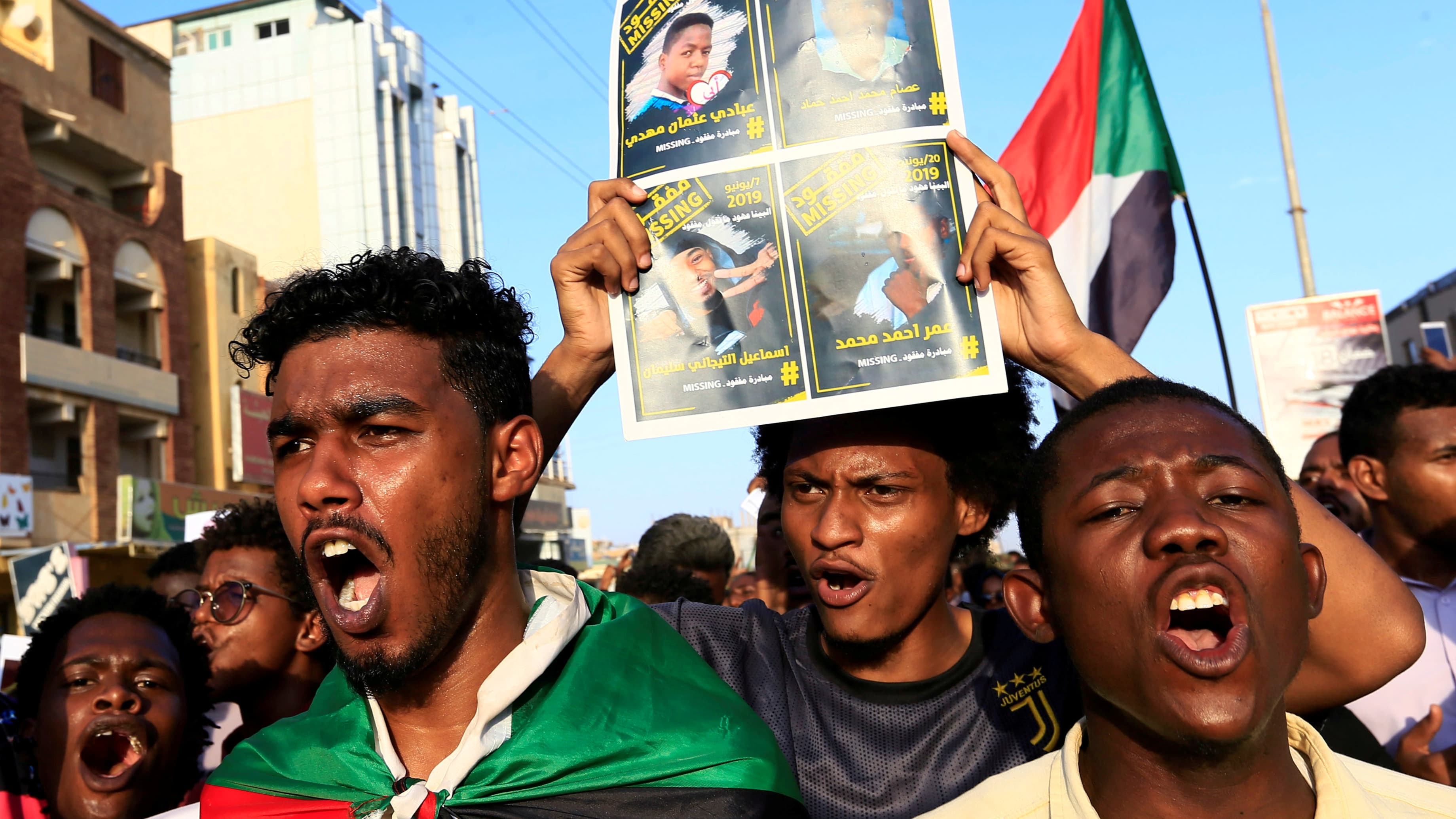 Sudanese protesters chant slogans during a rally calling for the former ruling party to be dissolved and for ex-officials to be put on trial in Khartoum, Sudan, Oct. 21, 2019.