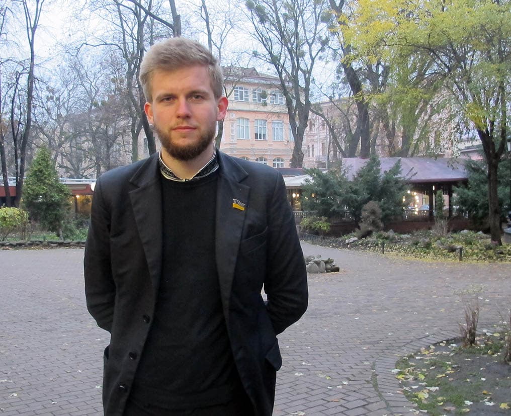 A man poses for a midshot