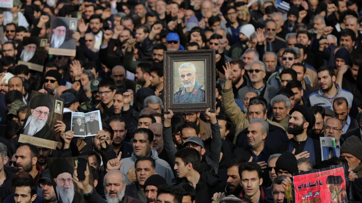 a group of men and women walk in protest.