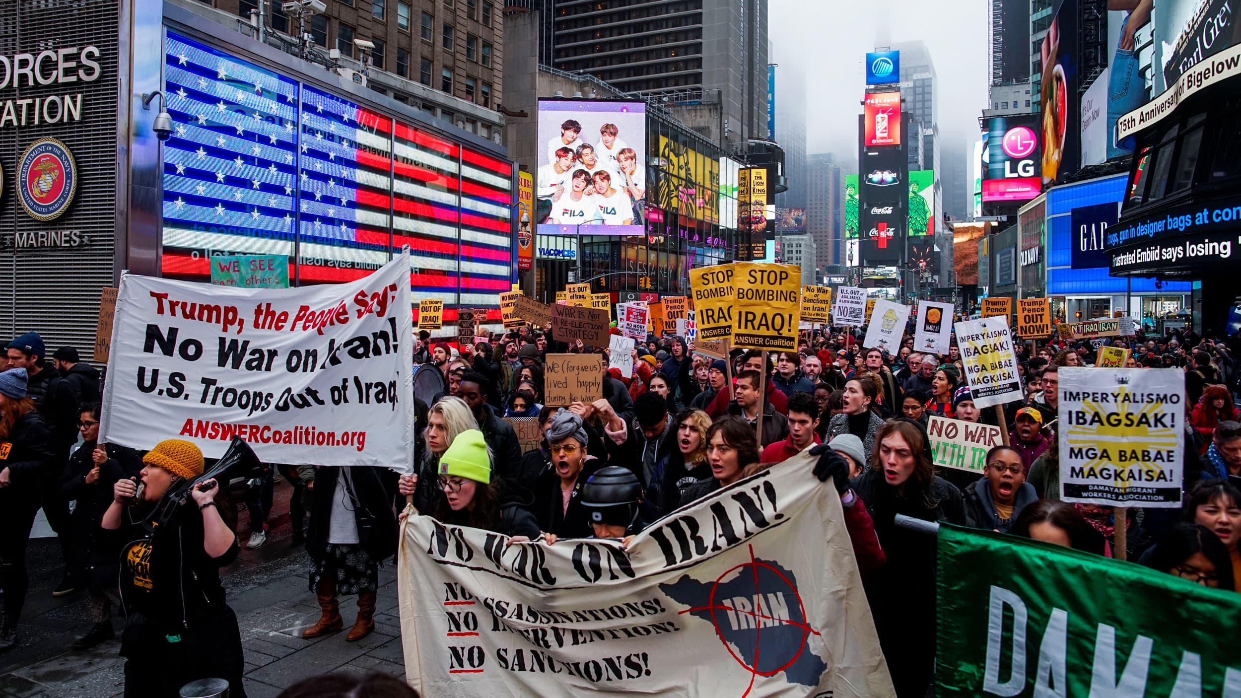People march as they take part in an anti-war protest