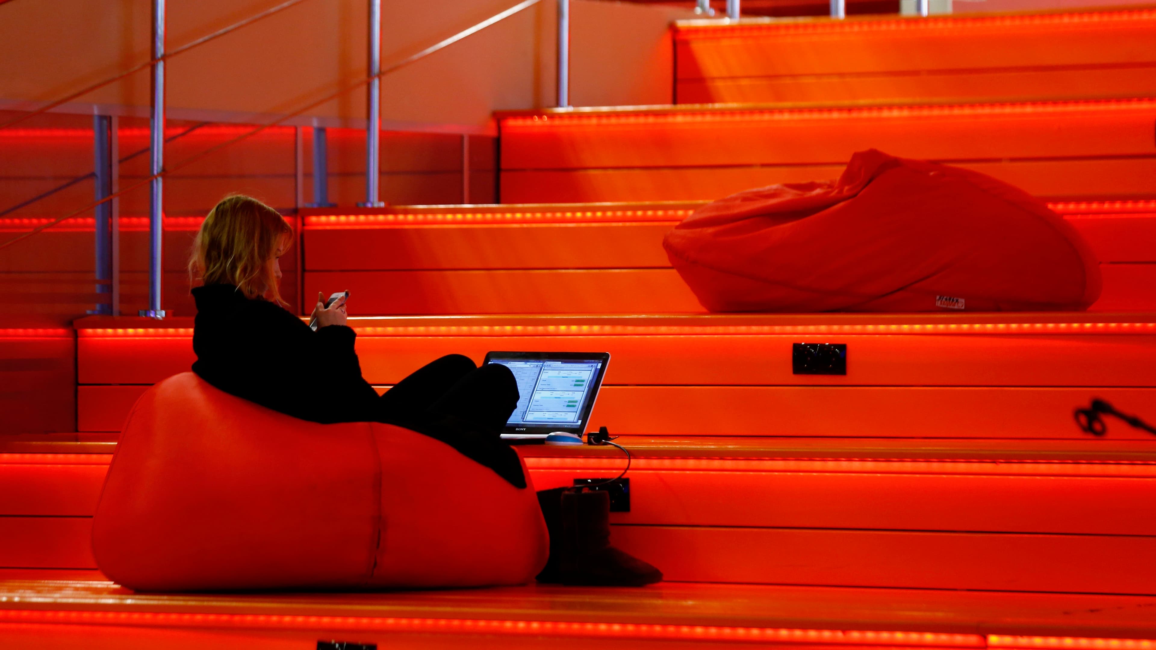 A woman with a laptop is seen in Hi-Tech Park Belarus building in Minsk, Belarus, March 17, 2016.