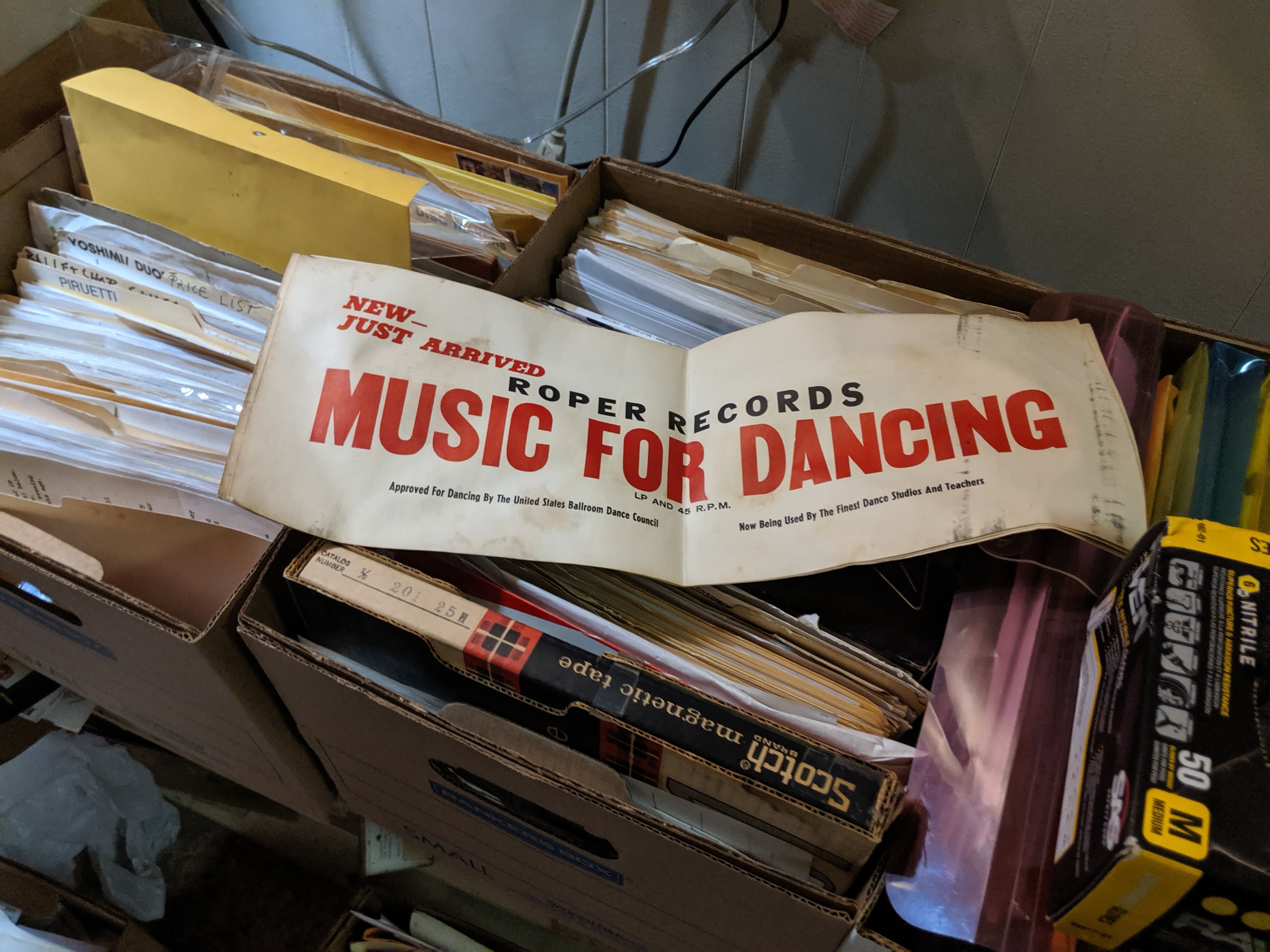 A Roper Records banner over filing boxes. The banner reads 