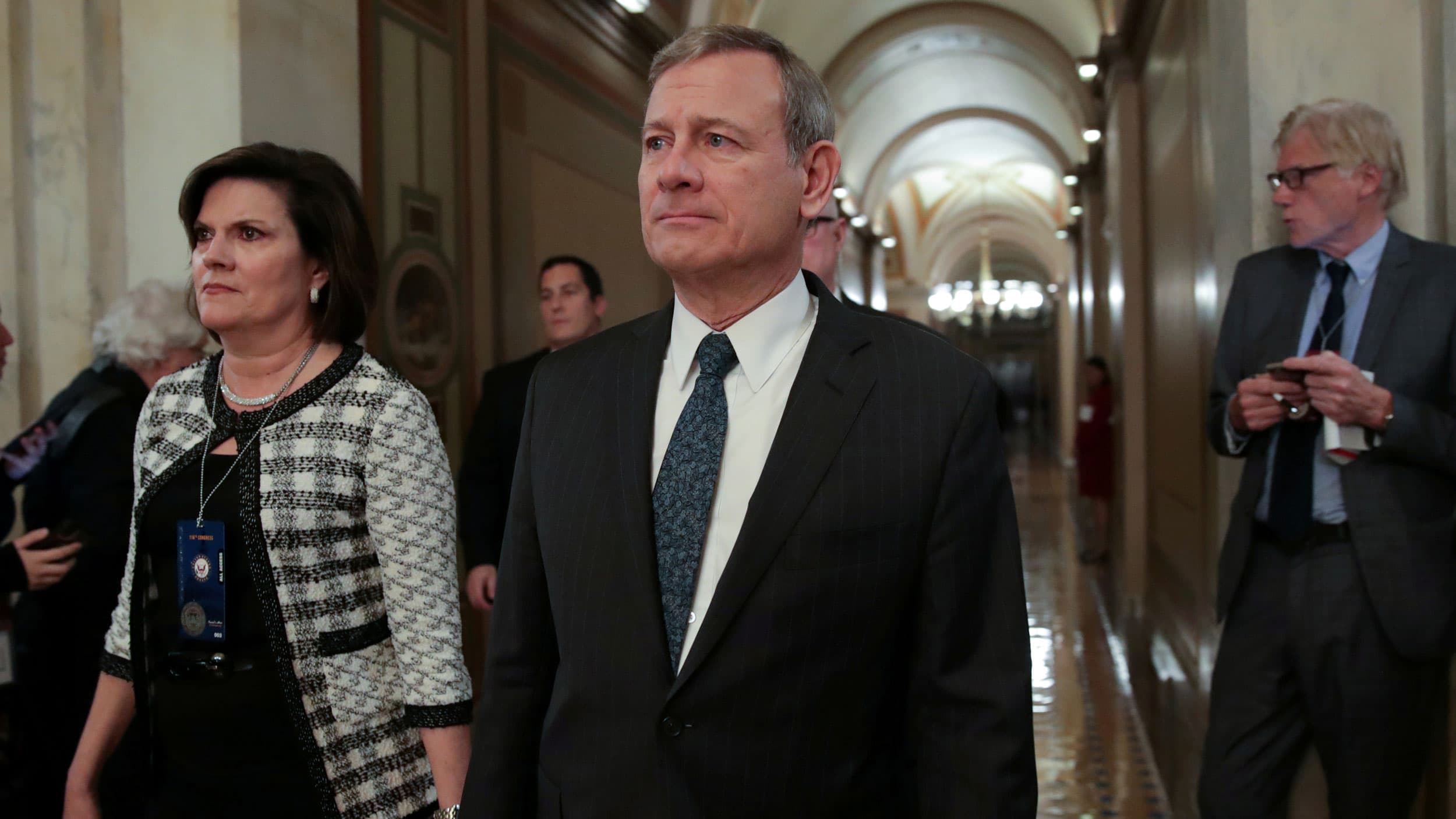 A man in a suit walking