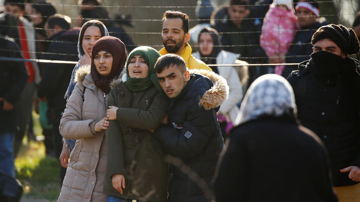 Two young women and a young man stand near each showing desperation on their face expressions.