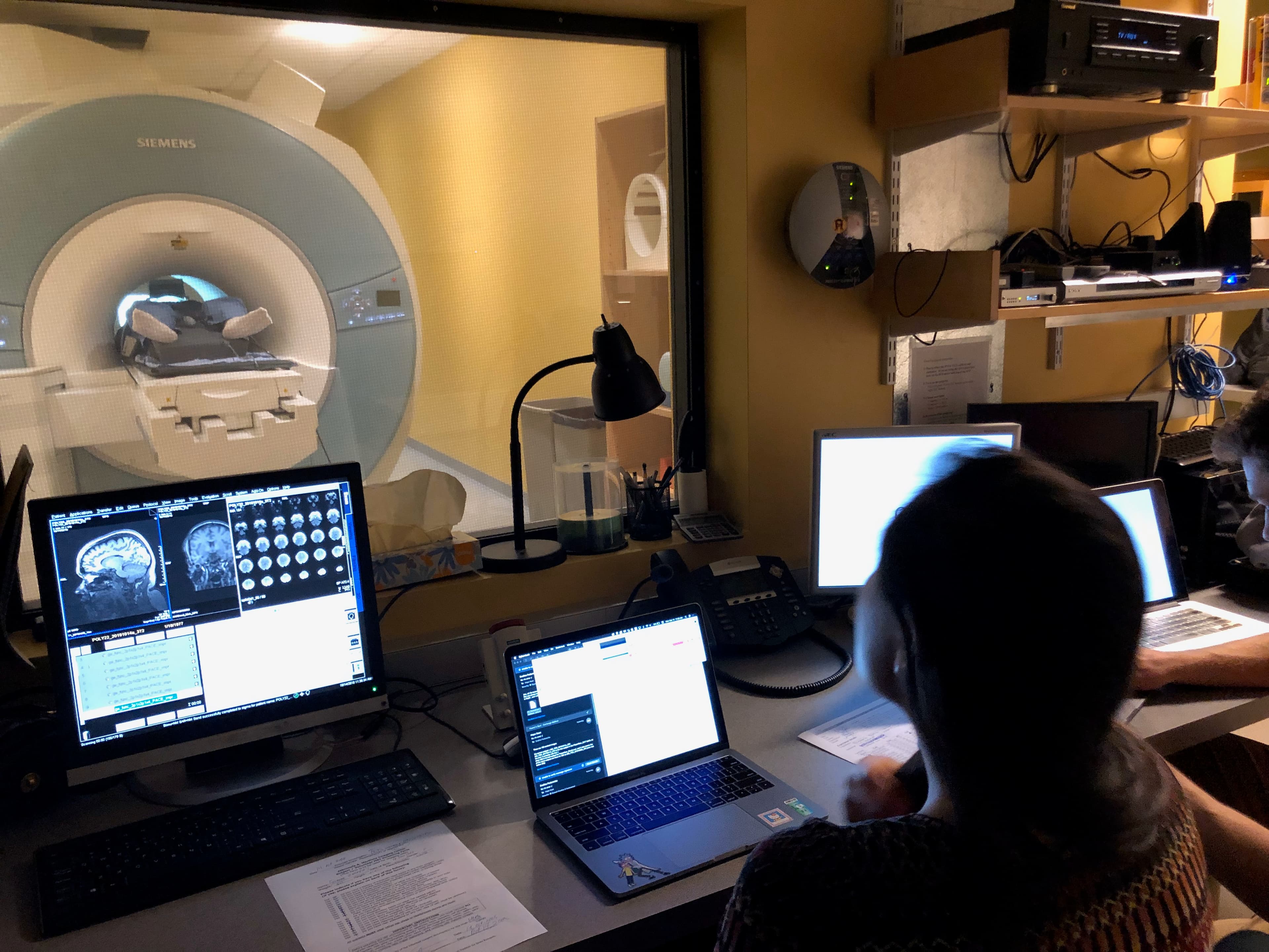 From the lab's control room, lab manager Hope Kean is shown at the controls with Susanna Zaraysky in the fMRI.