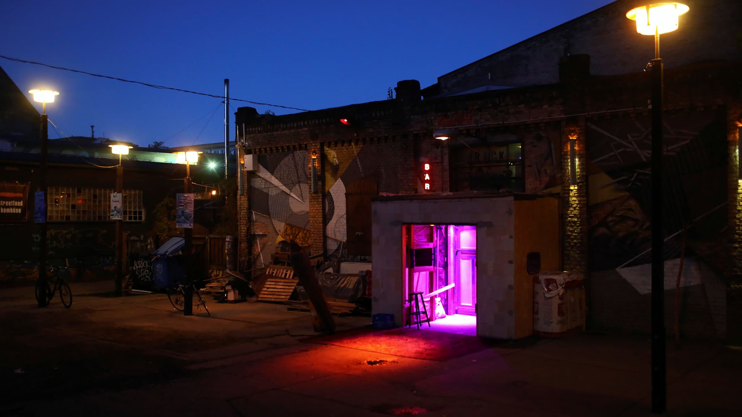 Dawn lights the sky behind nightclub Crack Bellmer in the RAW area of Berlin, Germany, on Sept. 6, 2016.