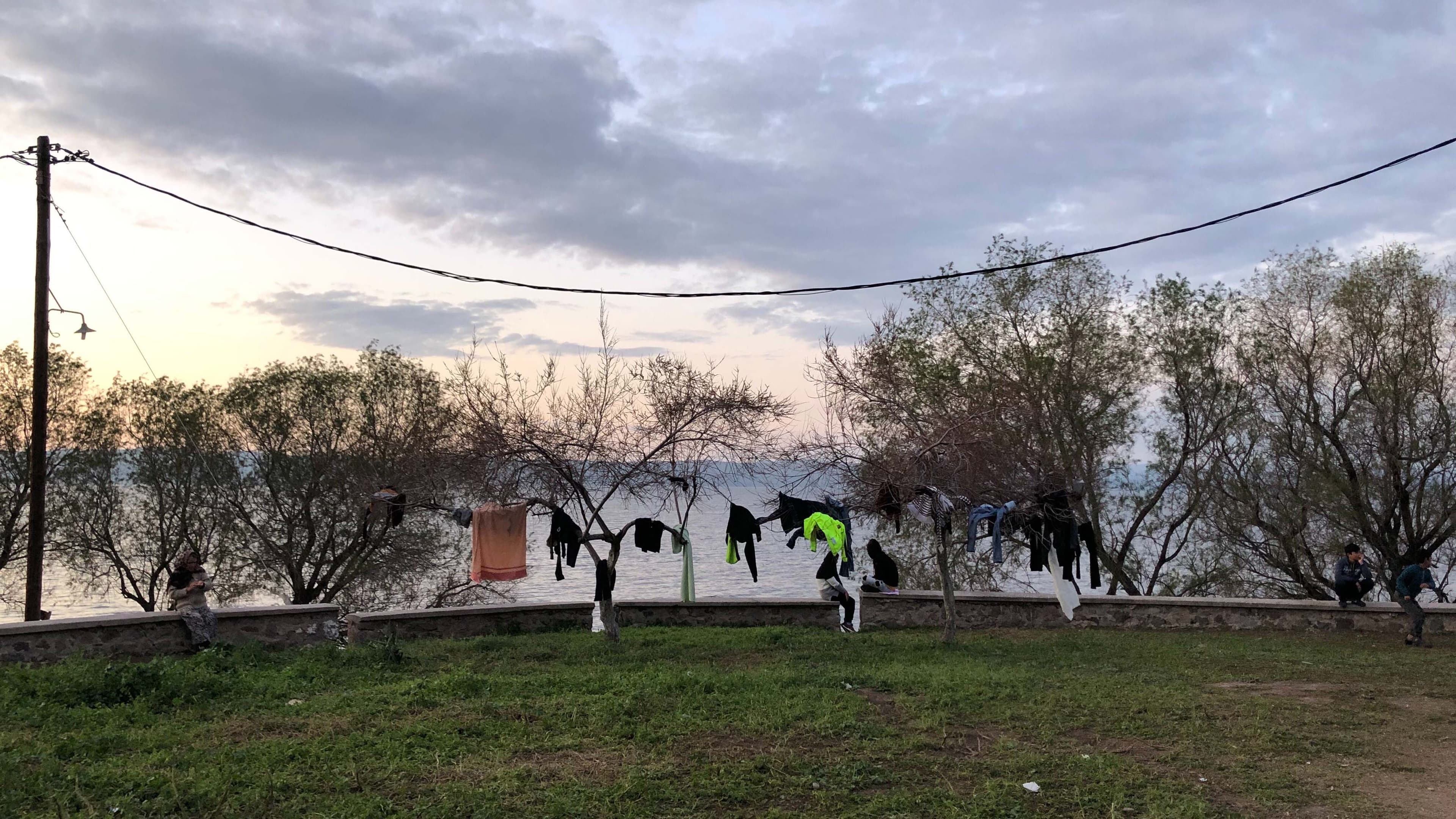 Asylum-seekers' clothes hang to dry near a makeshift camp for refugees on the Greek island of Lesbos.