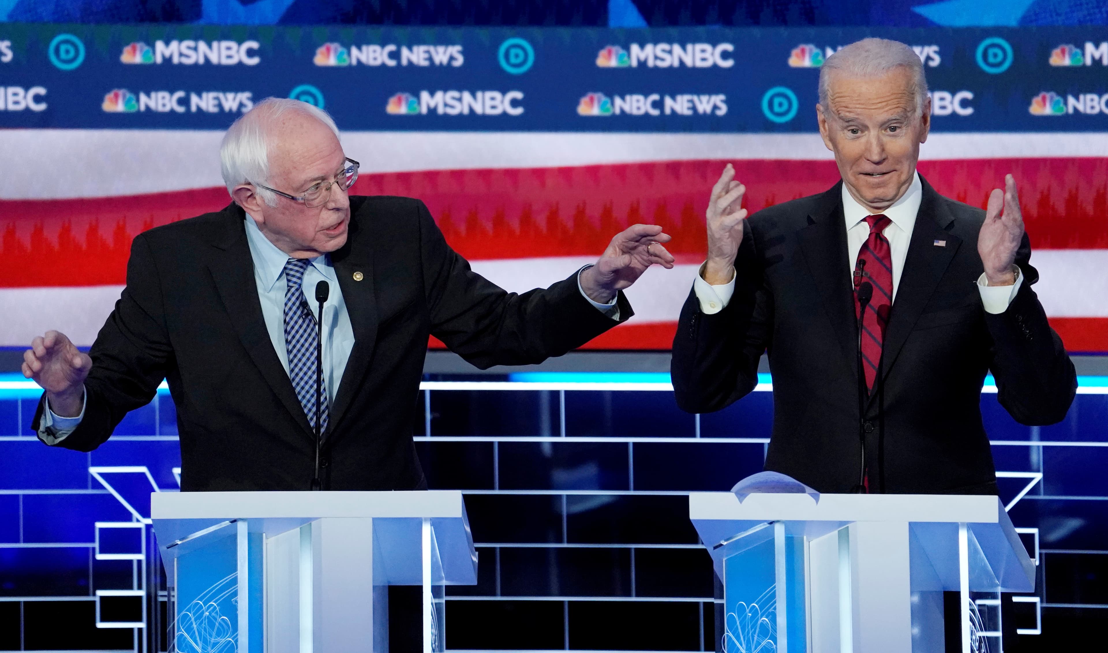 Senator Bernie Sanders speaks as former Vice President Joe Biden reacts during the ninth Democratic 2020 U.S. Presidential candidates debate at the Paris Theater in Las Vegas Nevada, on Feb. 19, 2020.
