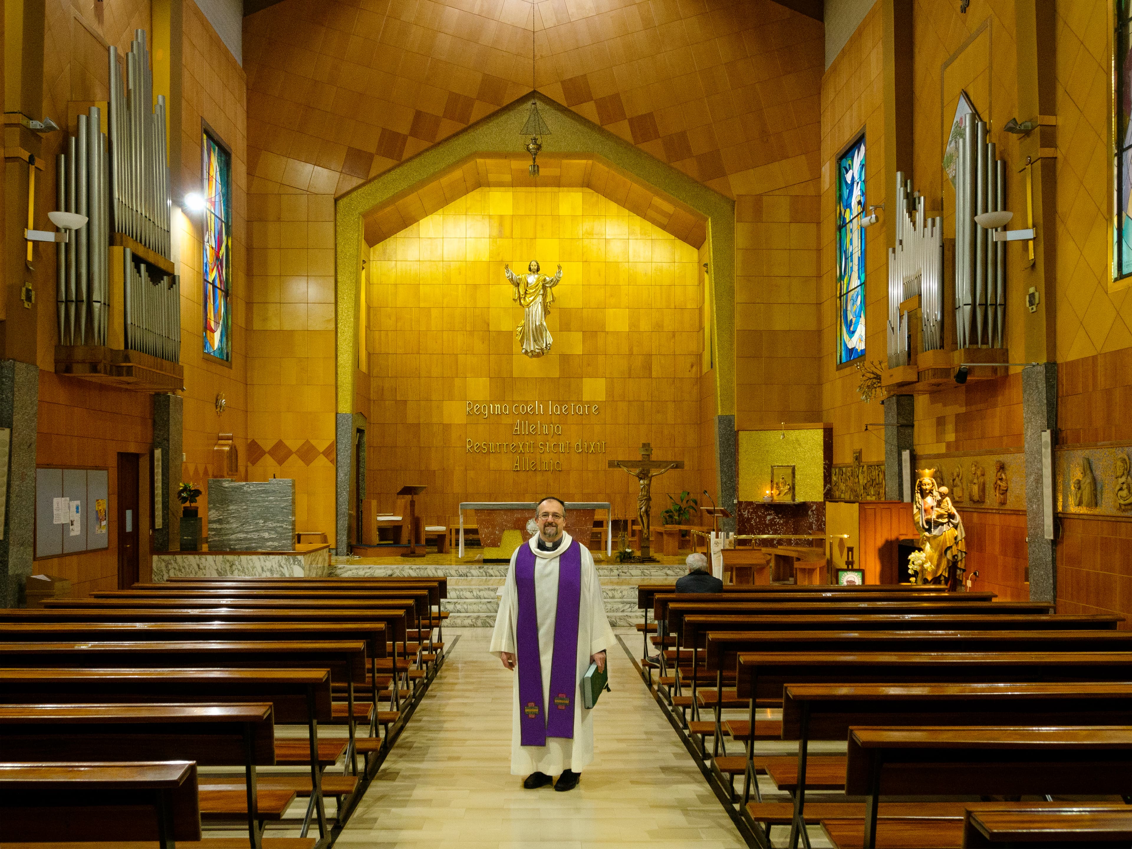Rev. Luca Peyron is shown in his church in Turin. 