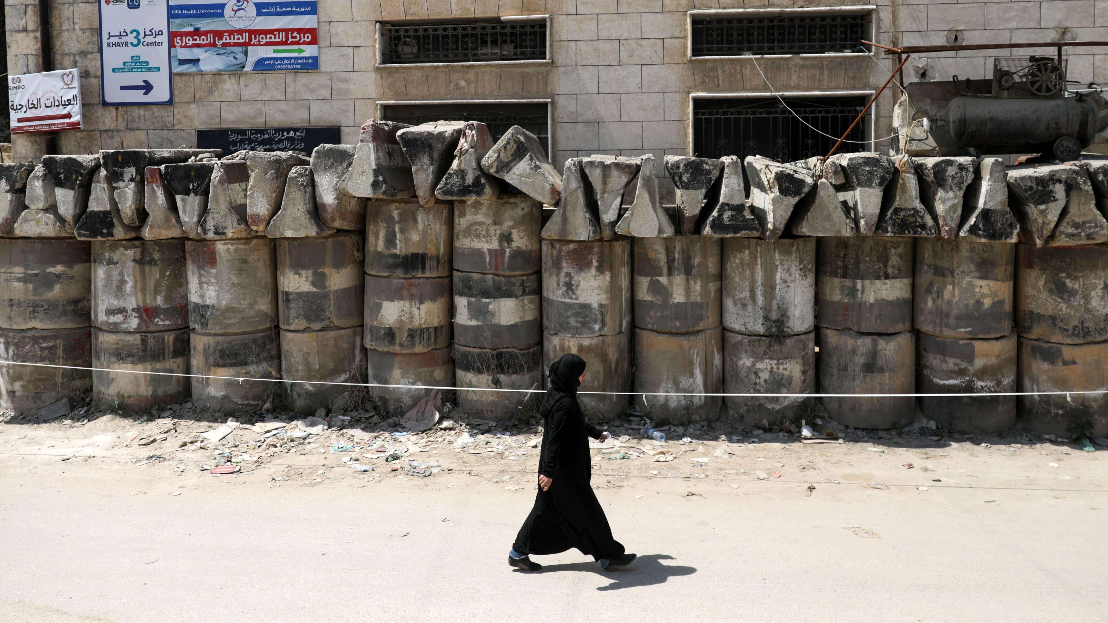 A woman walks inside a medical center that deals with coronavirus disease (COVID-19) testing in Idlib, Syria, April 13, 2020.