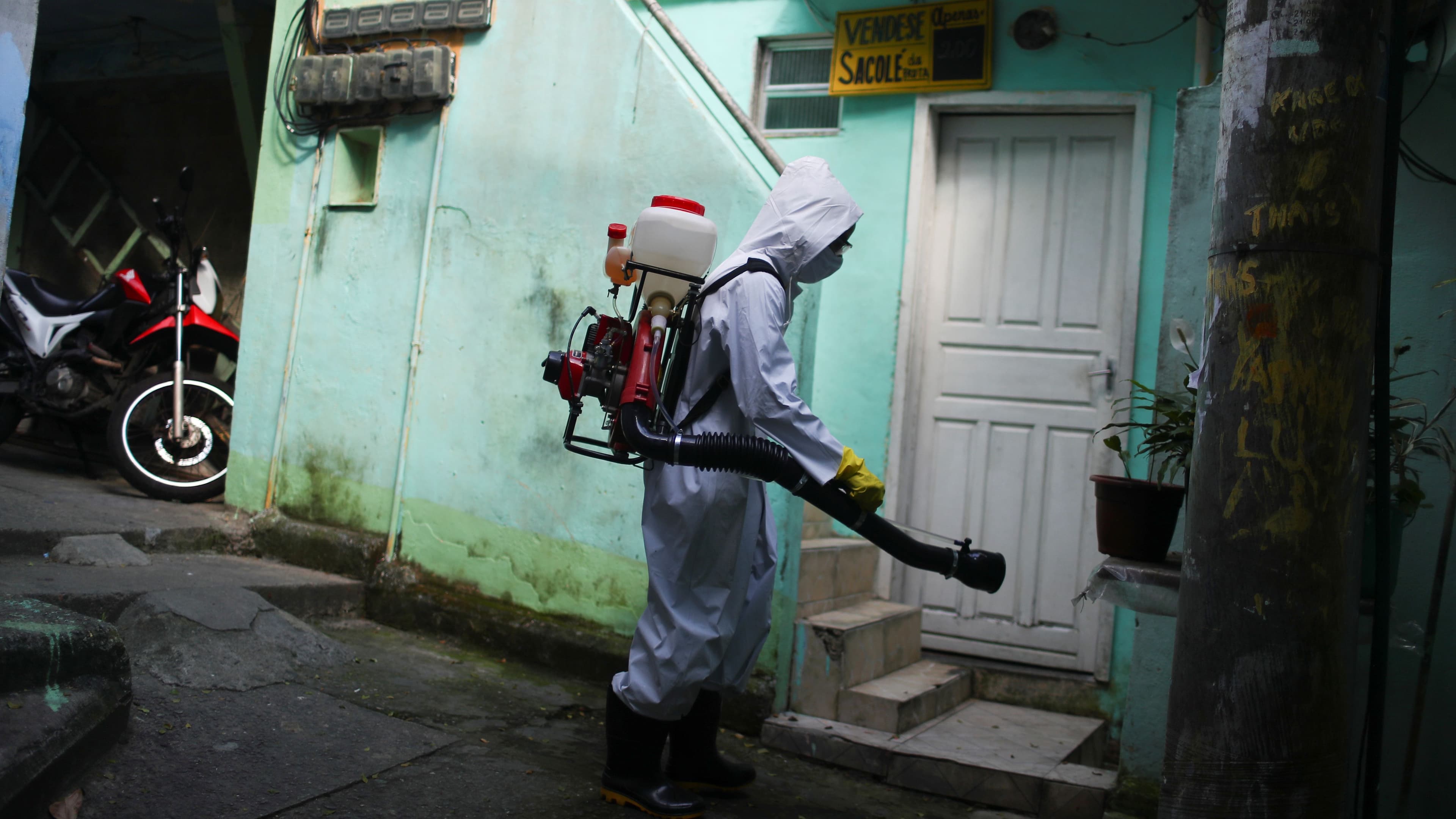 A worker disinfects the streets of the Vidigal slum, following the coronavirus disease (COVID-19) outbreak, in Rio de Janeiro, Brazil, April 24, 2020.
