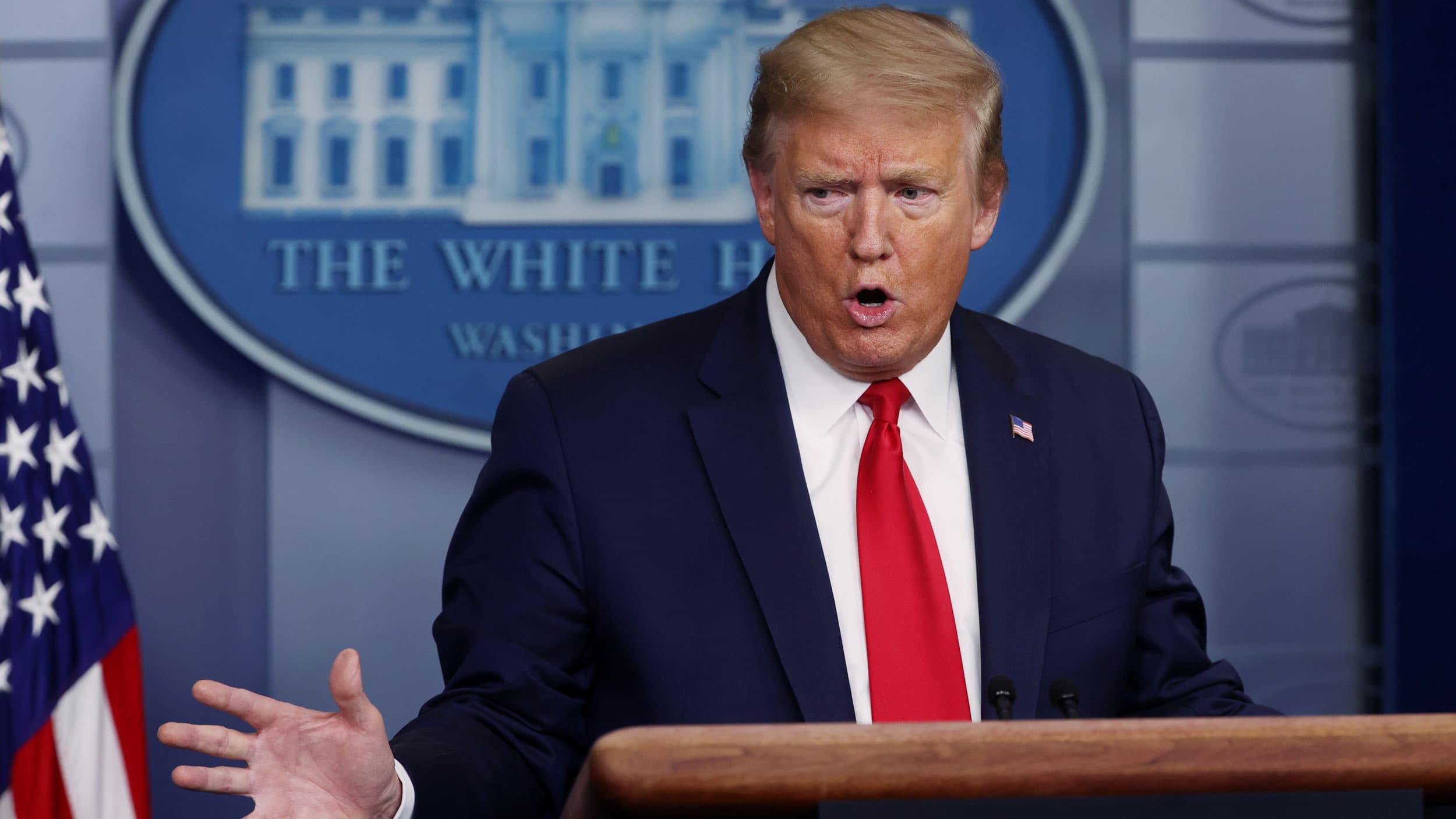 Donald Trump stands at a White House program