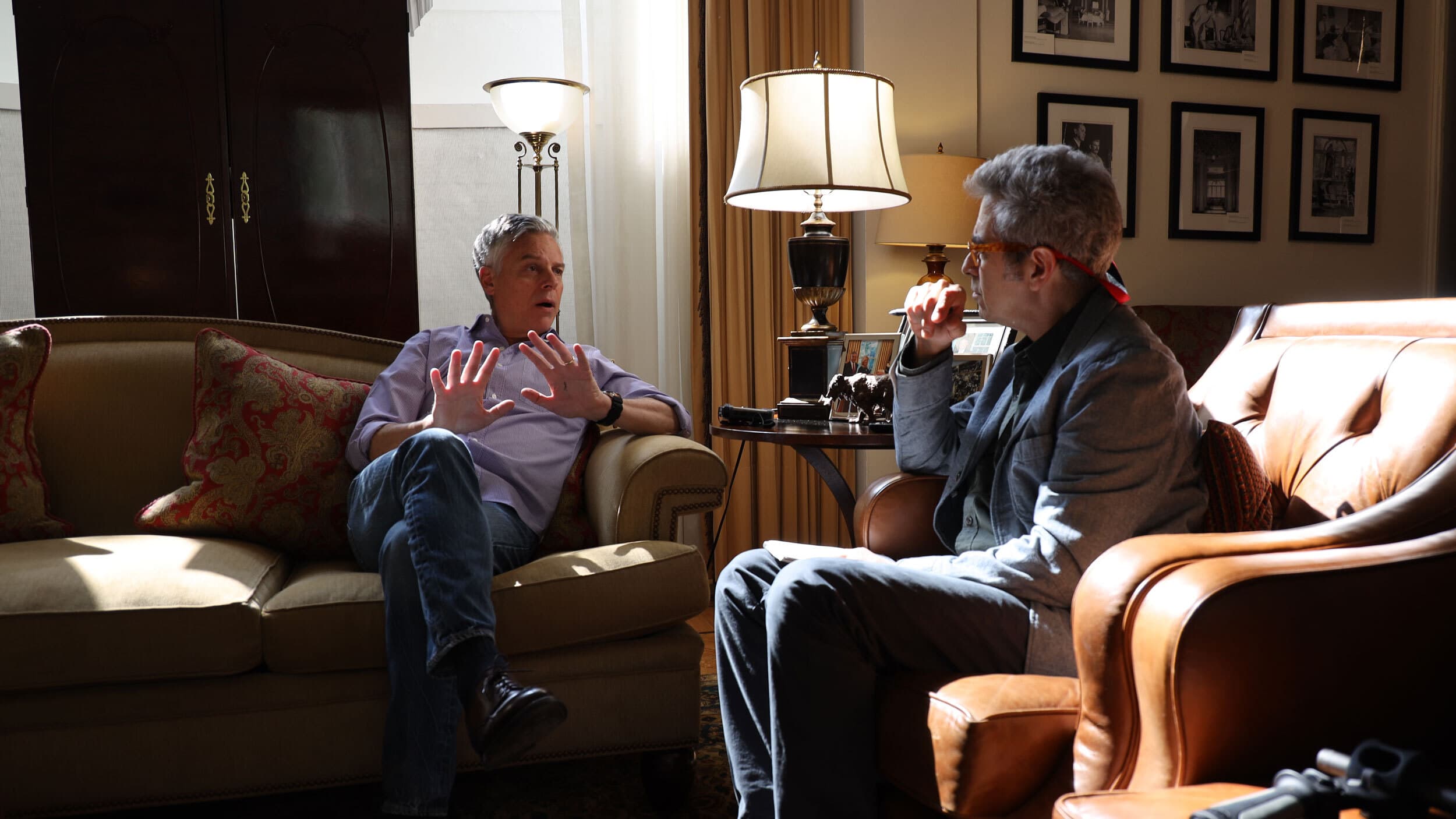 Two men sitting on couches