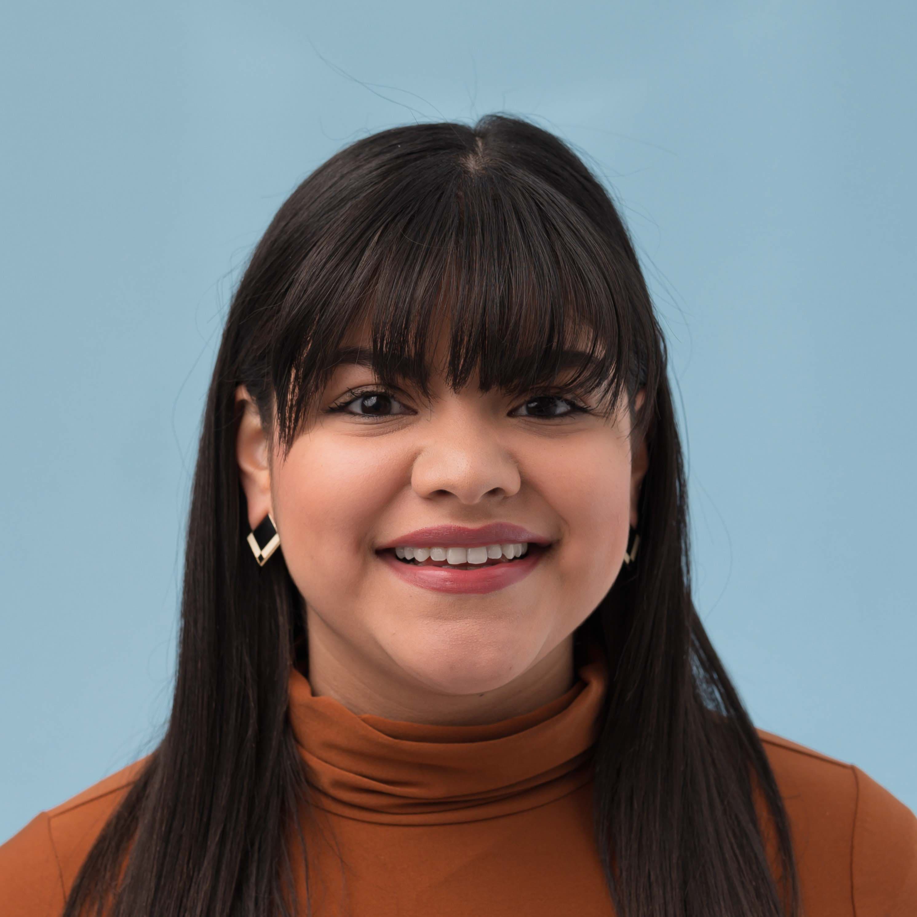 A woman posses for a photo