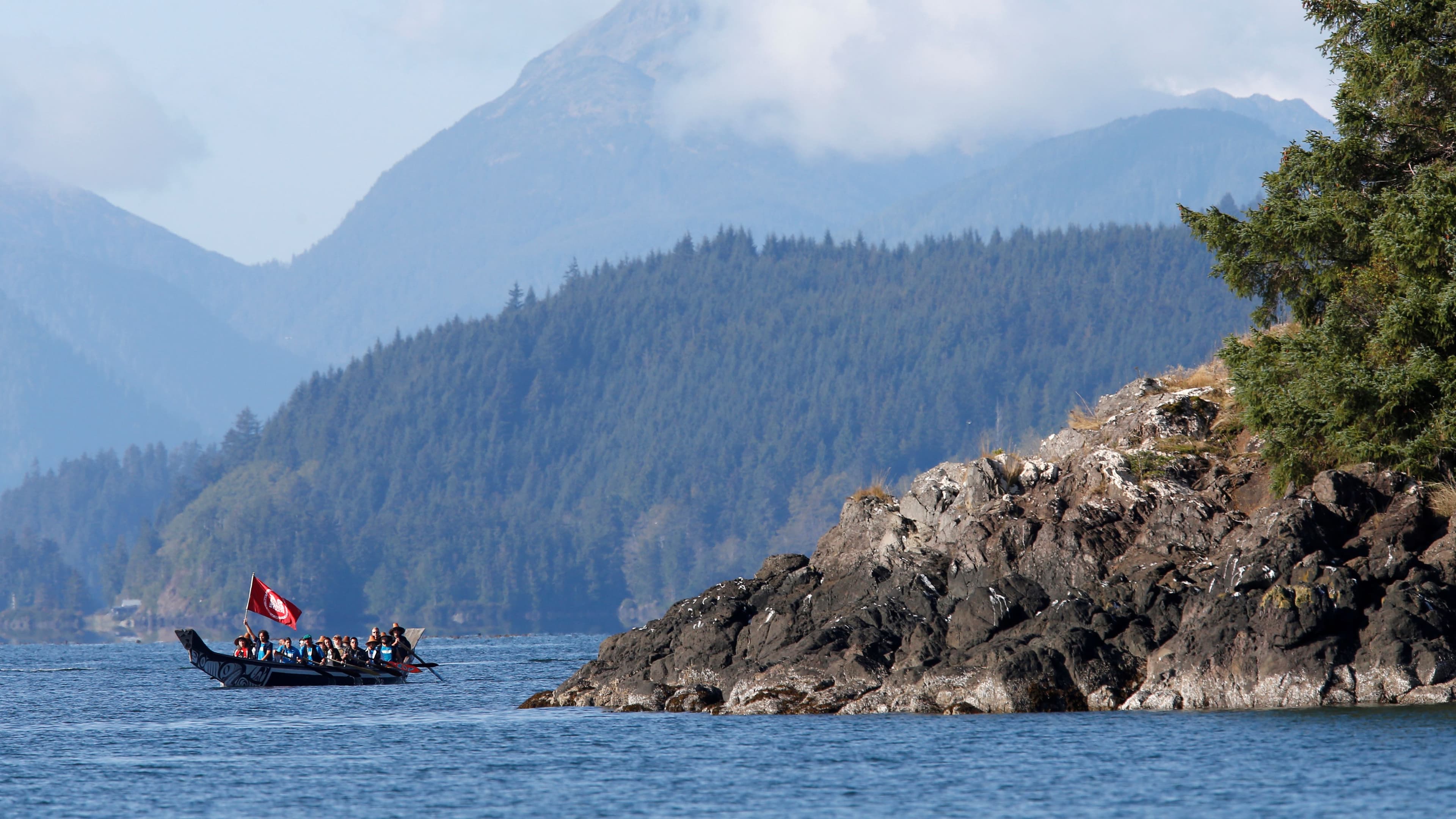 Britain's Prince William and Catherine, duchess of Cambridge, tour in a canoe during a visit to Haida Gwaii in Skidegate, British Columbia, Canada, Sept. 30, 2016.