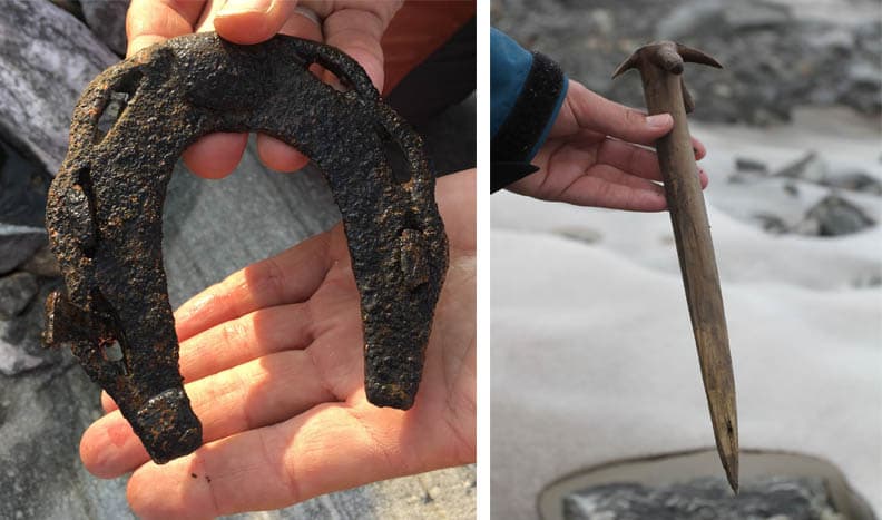 A photo of an ancient horseshoe and an ancient whisk