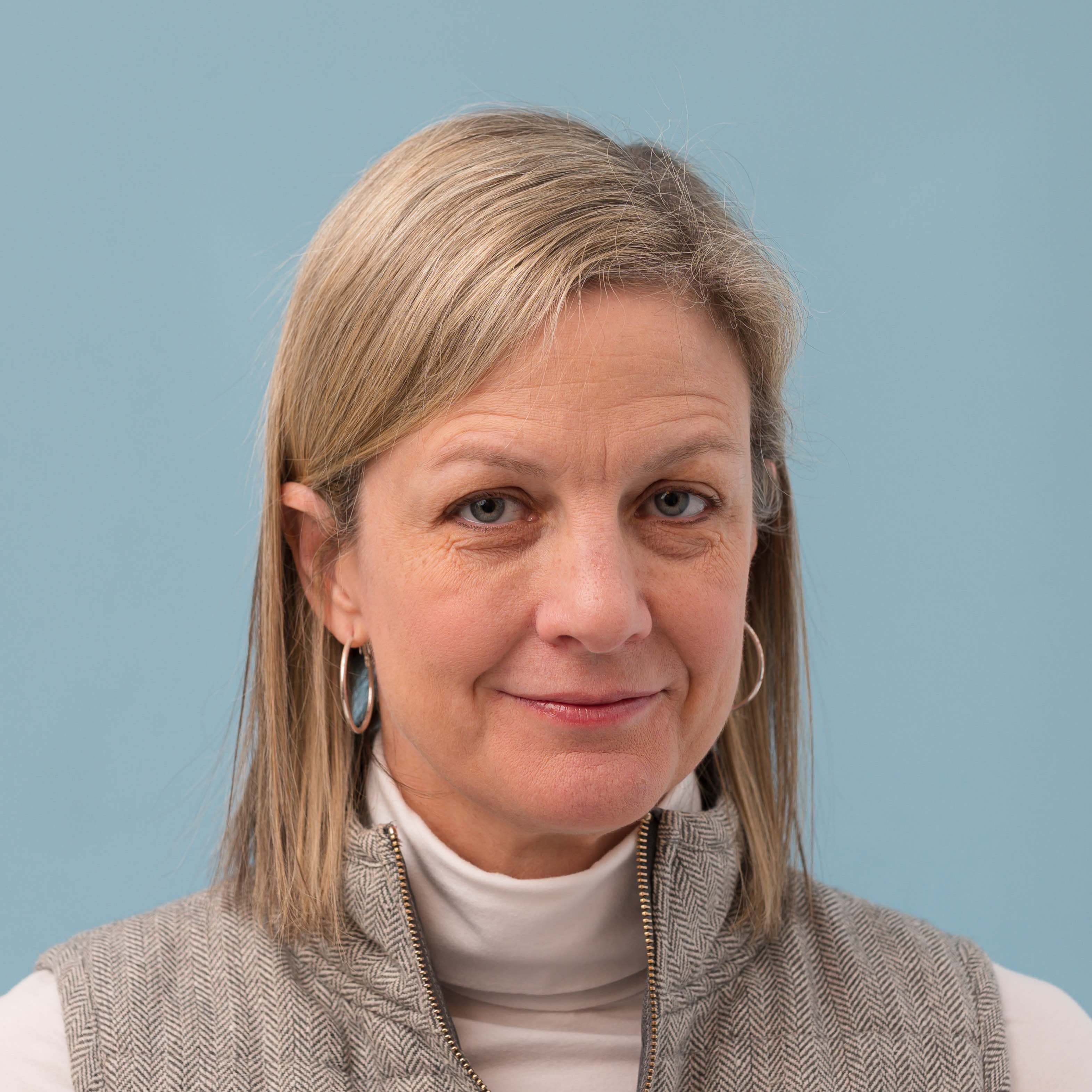 A woman looks at the camera for a photo.