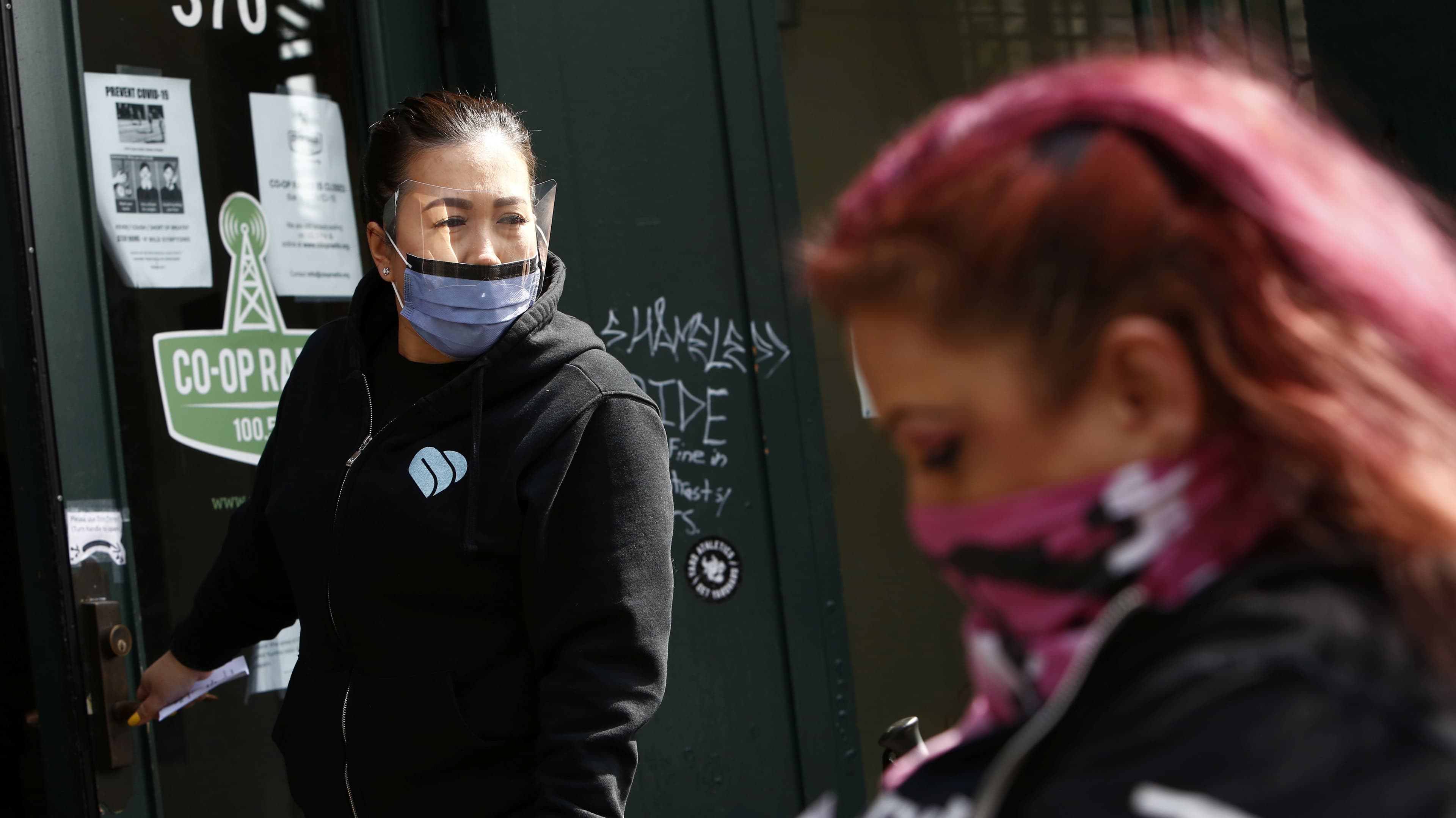 A front line worker from Portland Hotel Society healthcare checks on clients waiting to obtain a "safe supply" of narcotic alternatives, provided by the local health unit to combat overdoses due to poisonous additives and to help supports addicts and home