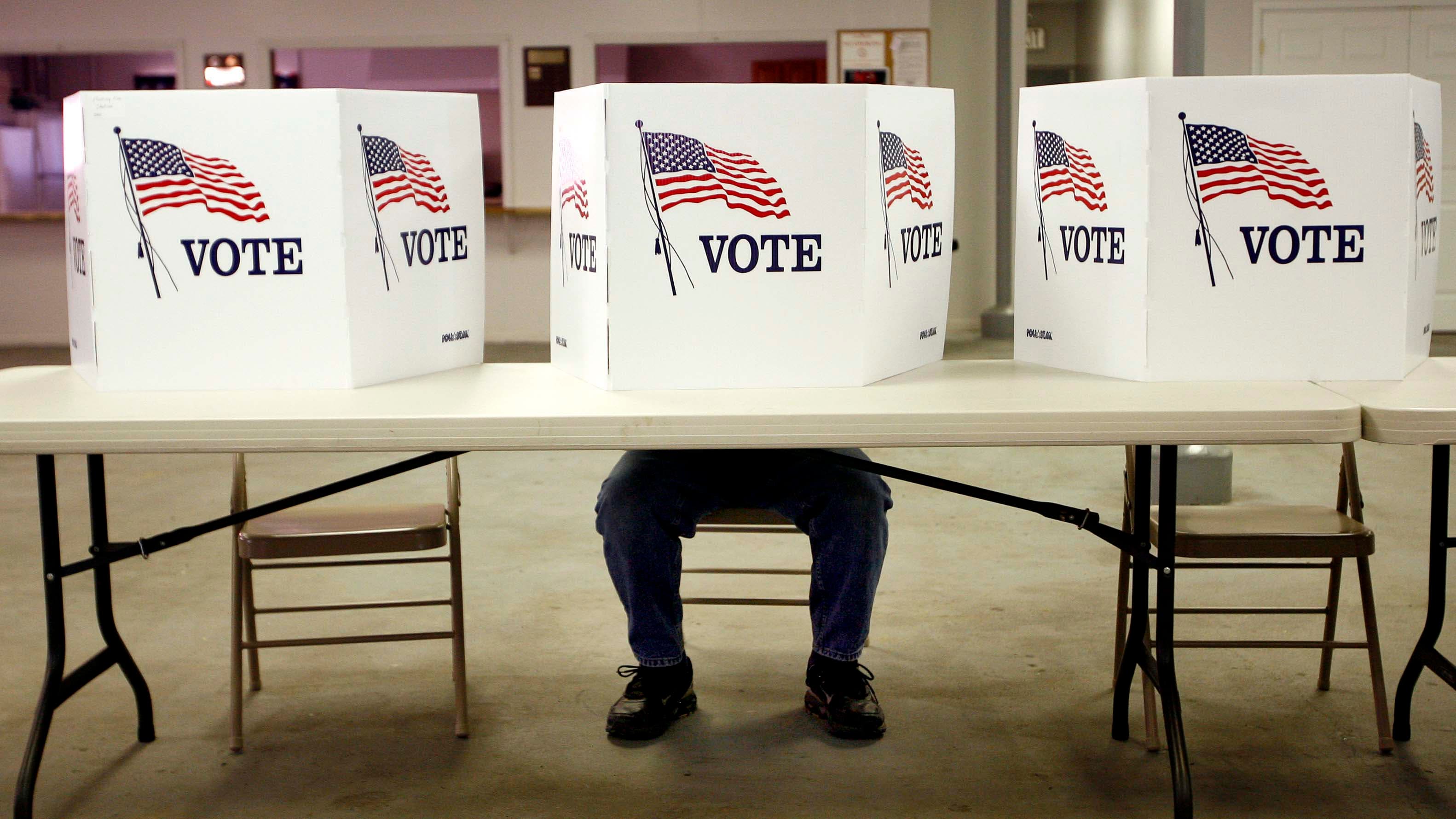 A voter casts a ballot at the Flushing Volunteer Fire Department in Flushing, Ohio, on "Super Tuesday," March 6, 2012.