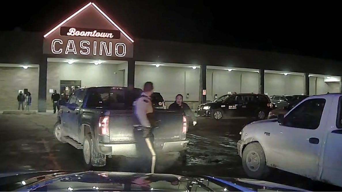 Chief Allan Adam of Athabasca Chipewyan First Nation exits the passenger seat of a truck before his violent arrest by Royal Canadian Mounted Police (RCMP) officers, in a still from police dashcam video obtained during legal discovery, in Fort McMurray, Al