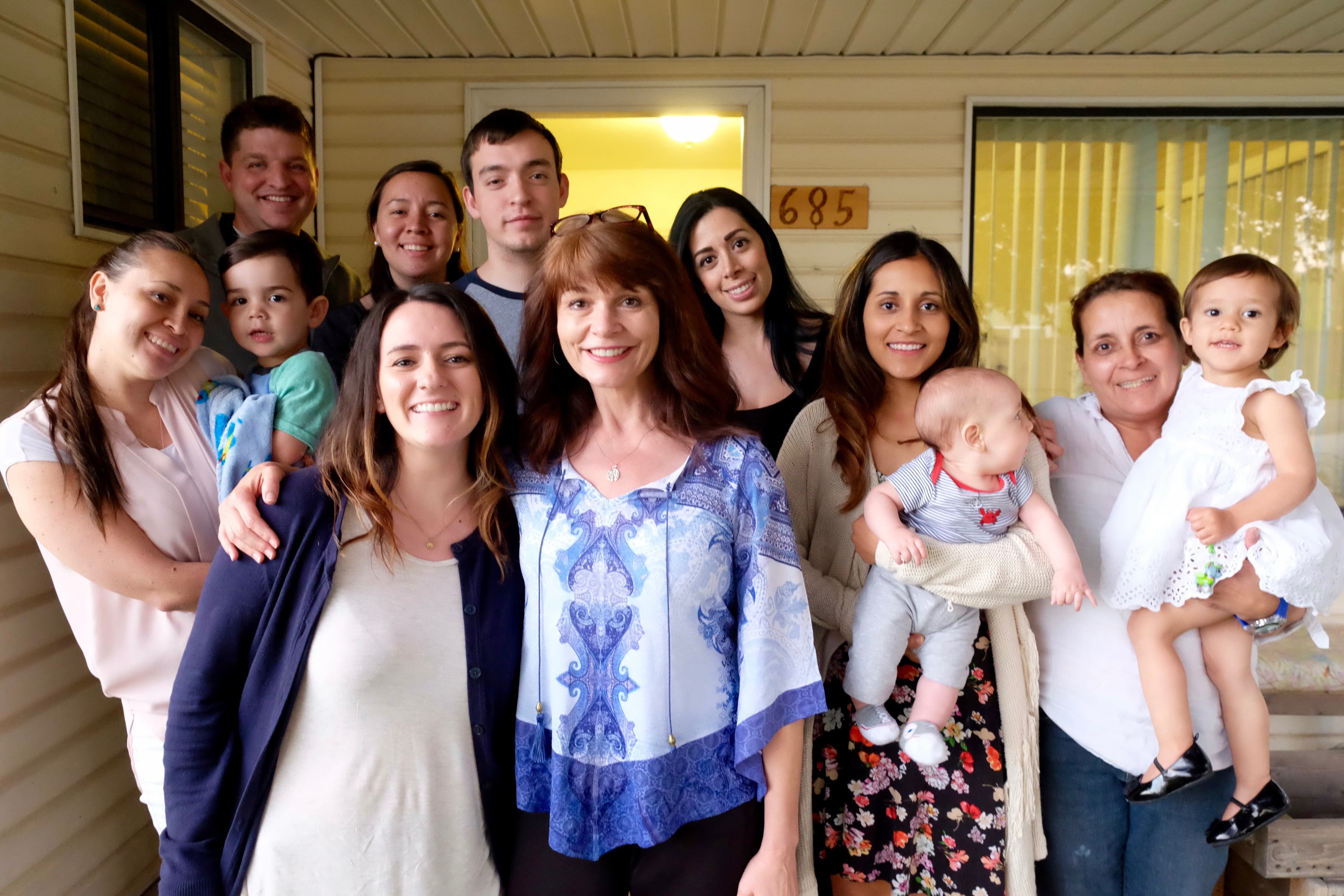 Sharlee Mullins Glenn, a founder of Mormon Women for Ethical Government, visits with the family of Teresa Ramos in Draper, Utah. Ramos was deported to Colombia in April.