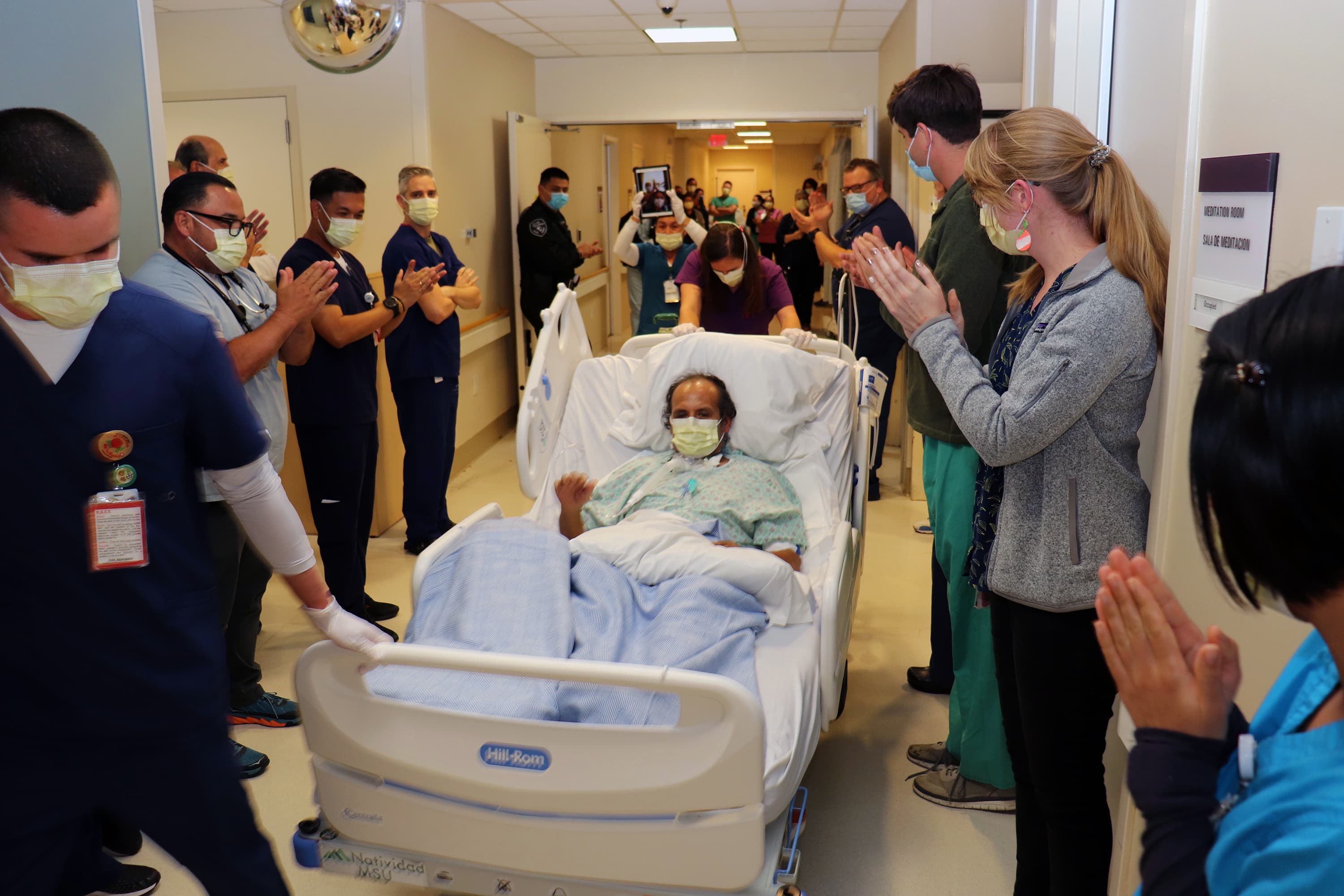Anastacio Cruz, center, a farmworker, leaves Natividad Medical Center in Salinas, California, where he spent more than six weeks after contracting the coronavirus, on June 29, 2020.