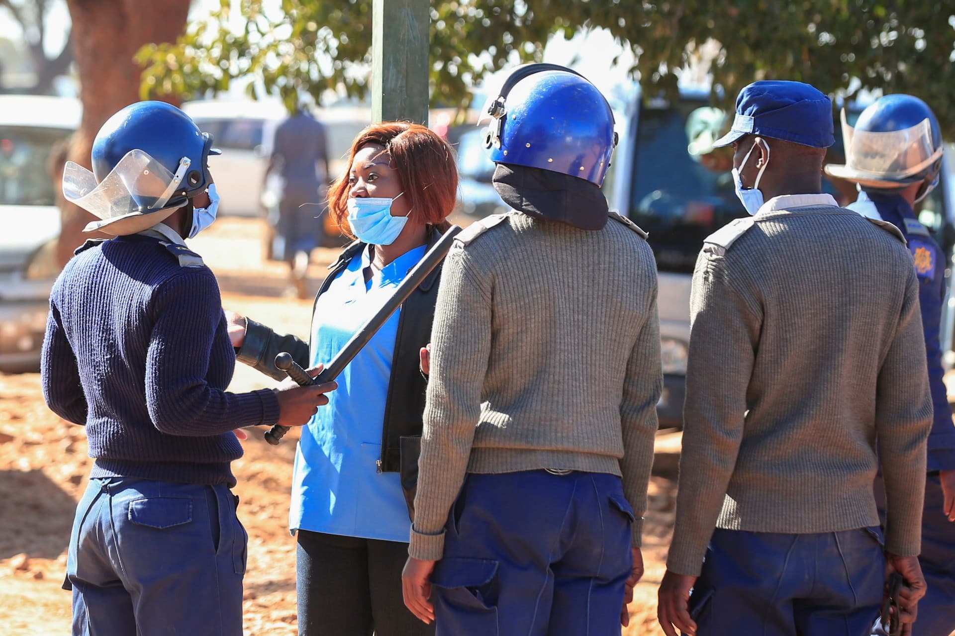 A nurse talks with police.