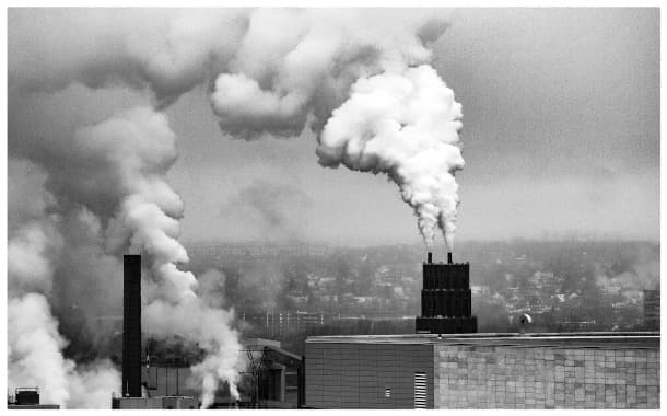 gray and white smokestacks billow
